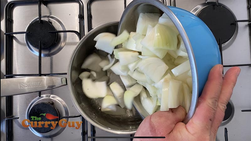 Adding the onions to make base curry gravy