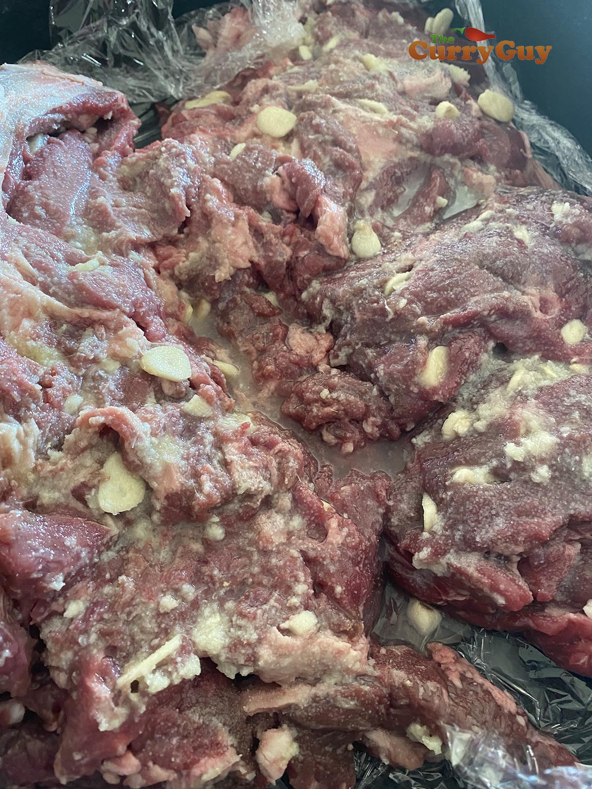 Marinating lamb raan