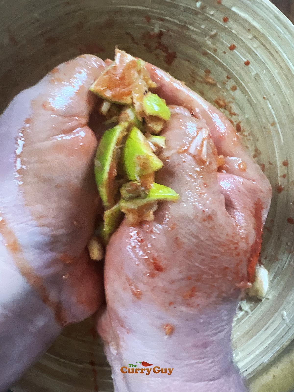 Squeezing juice from the limes and garlic