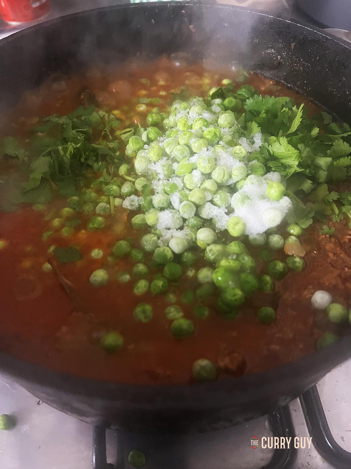 Stirring in the peas.