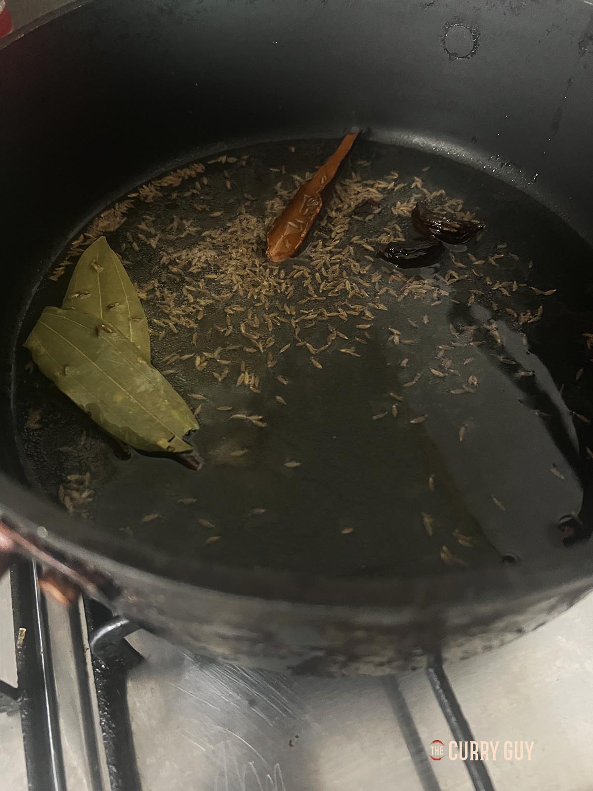 Tempering whole spices into oil.