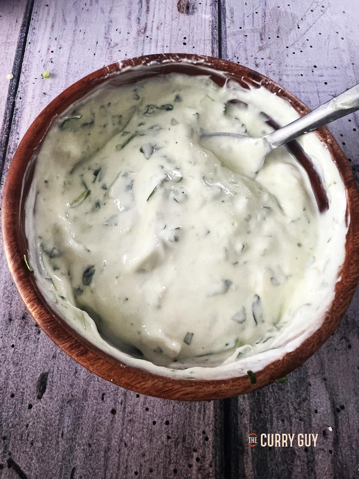 The raita stirred together before adding the infused oil.
