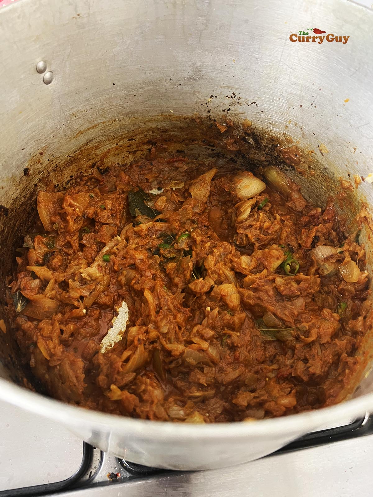 Adding a little water to the pot.