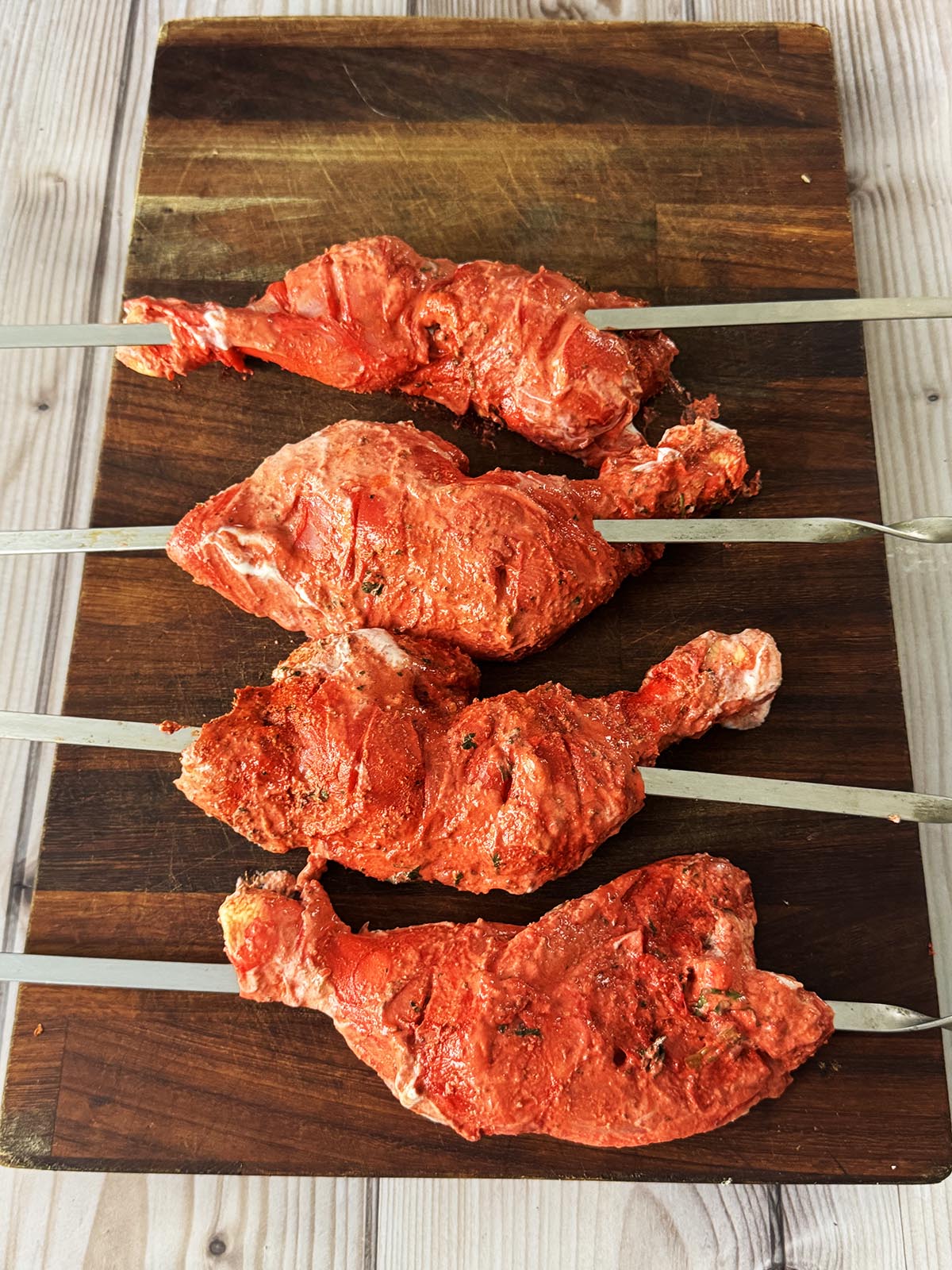 The chicken legs skewered.