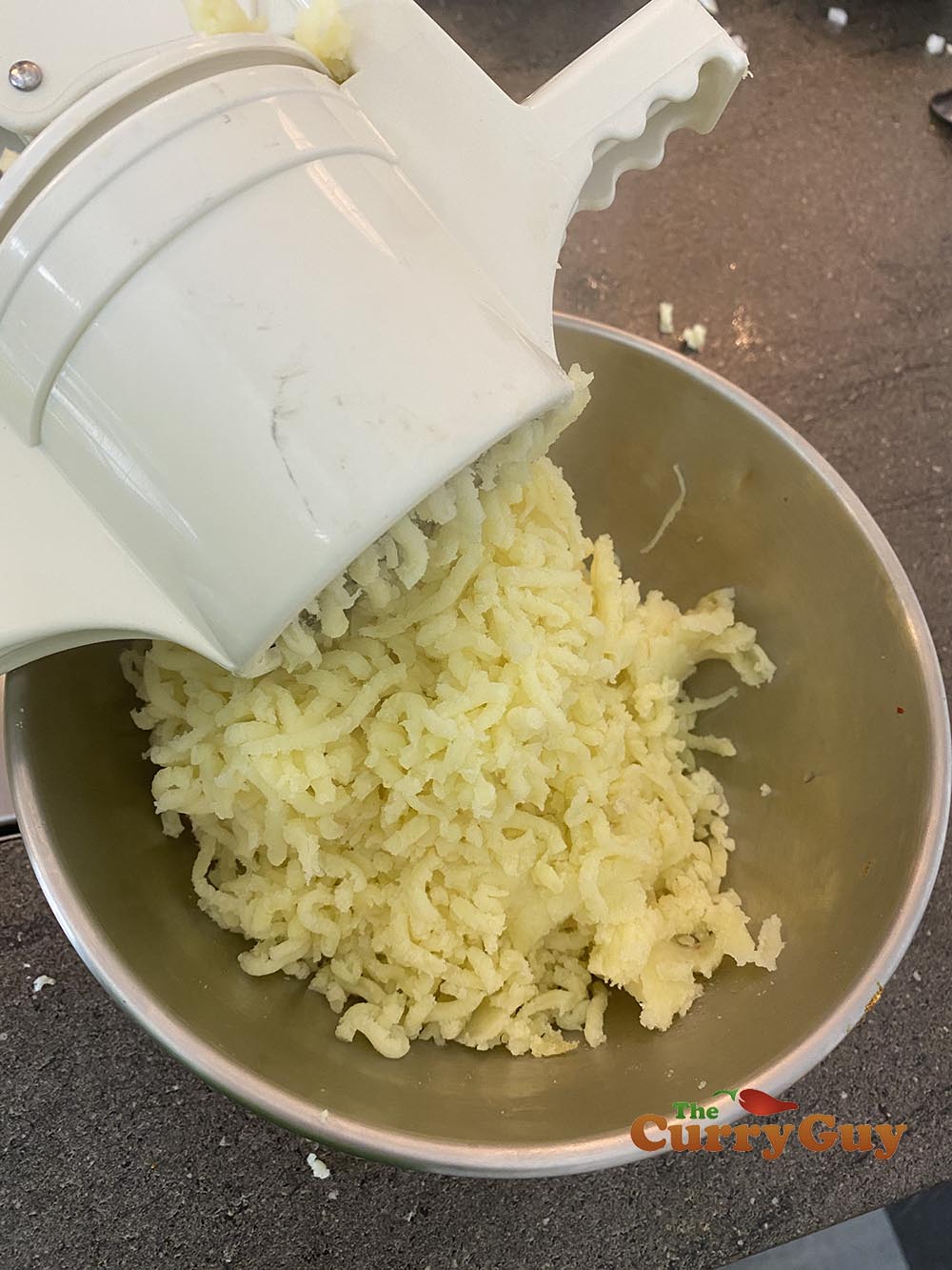 running mashed potatoes through a ricer