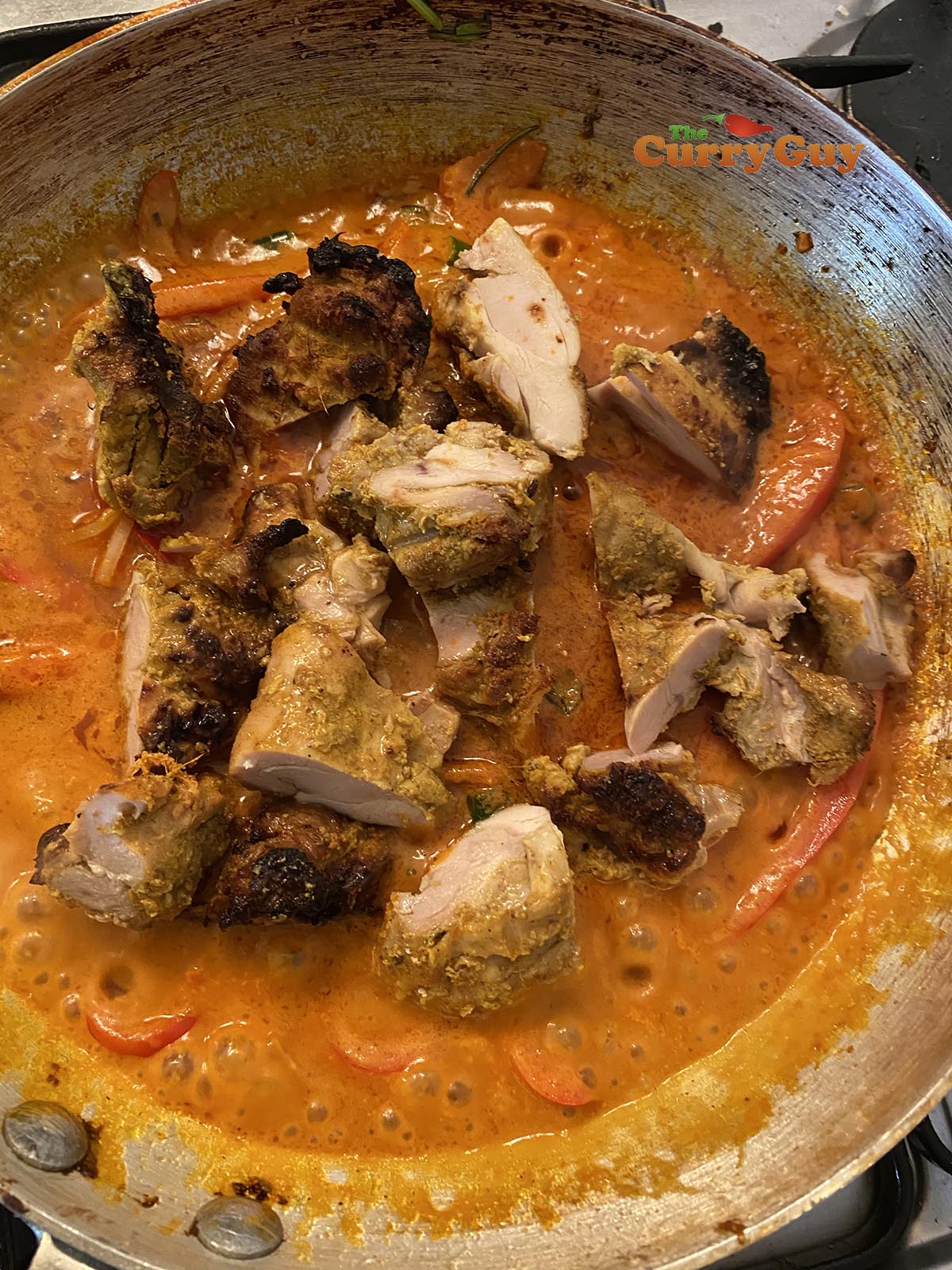 Adding meat to the chicken jalfrezi curry