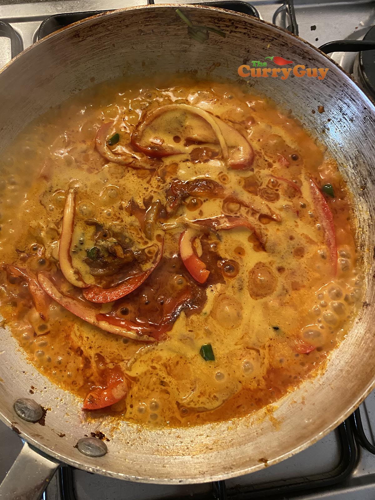 Stirring in base curry sauce.