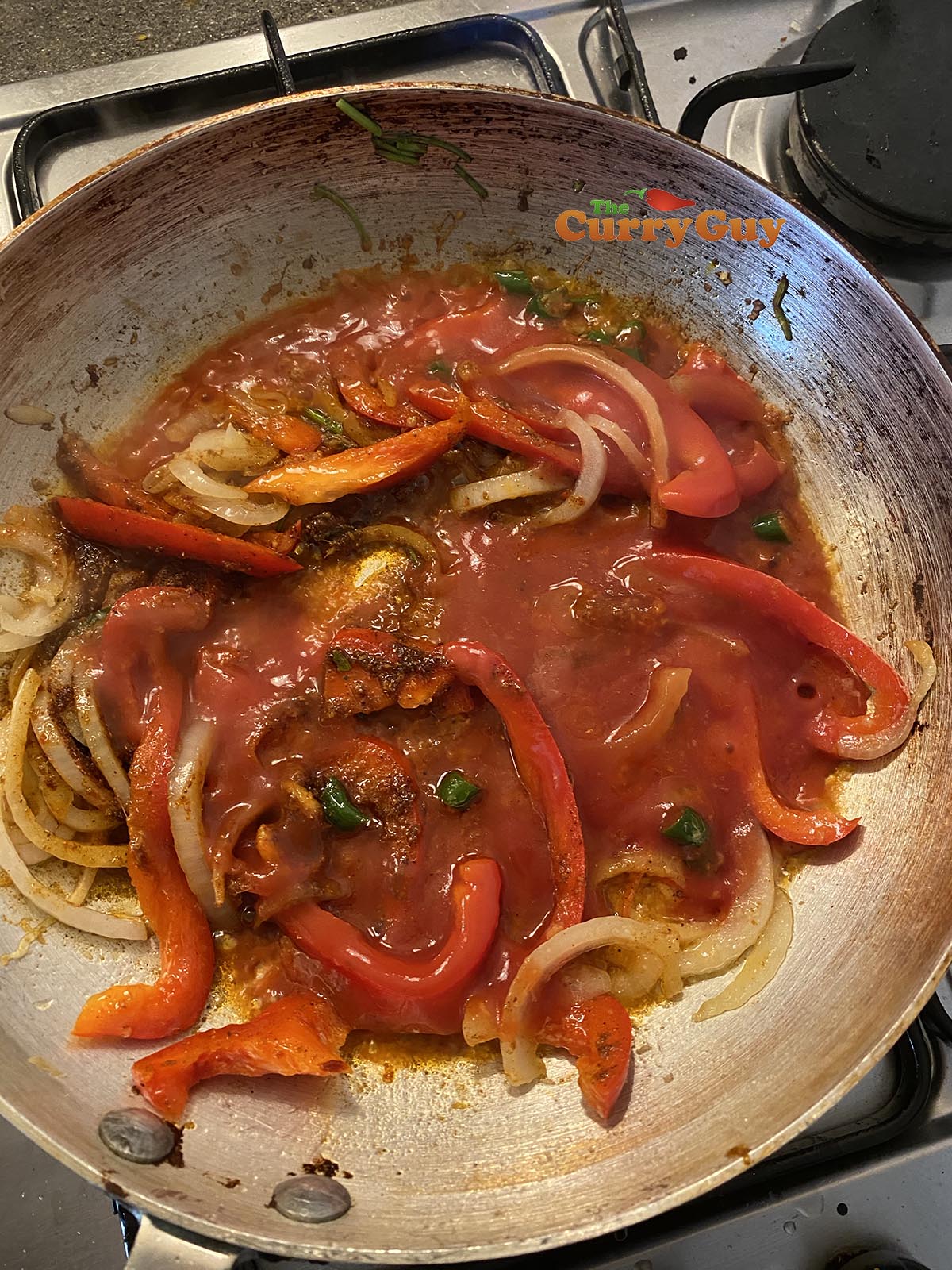 Pouring in the tomato puree