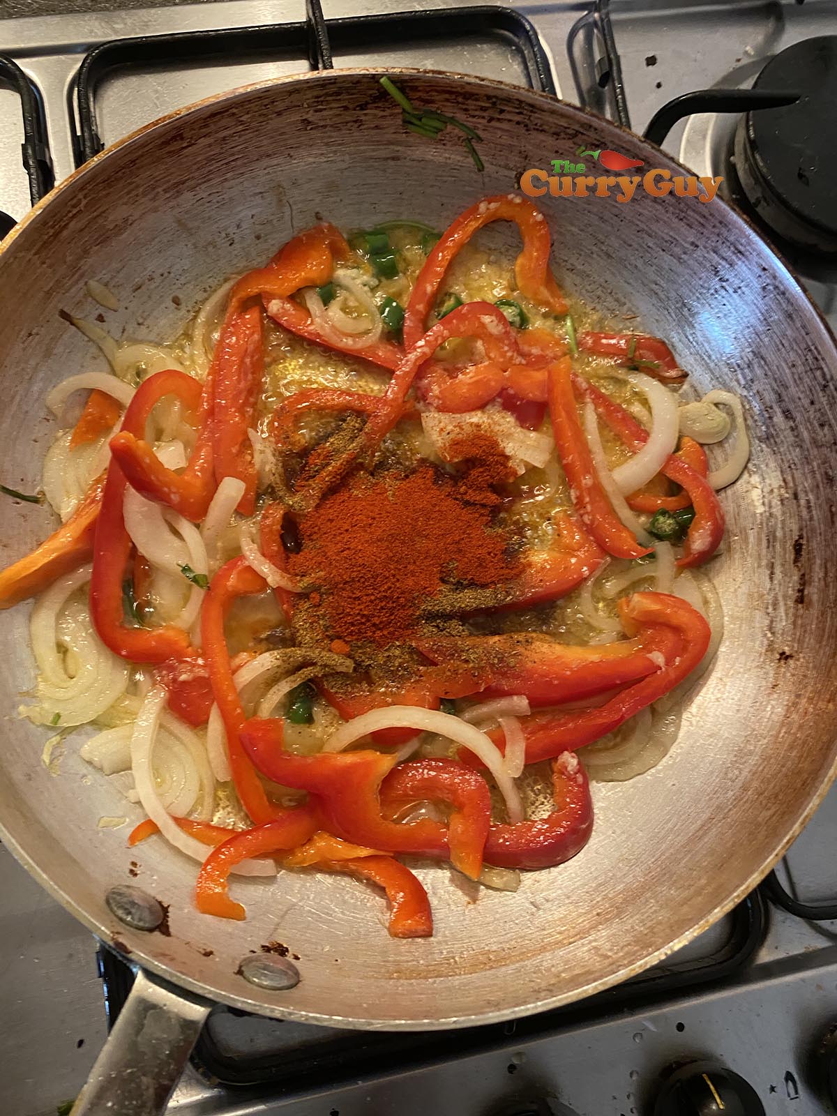 Adding ground spices to the pan