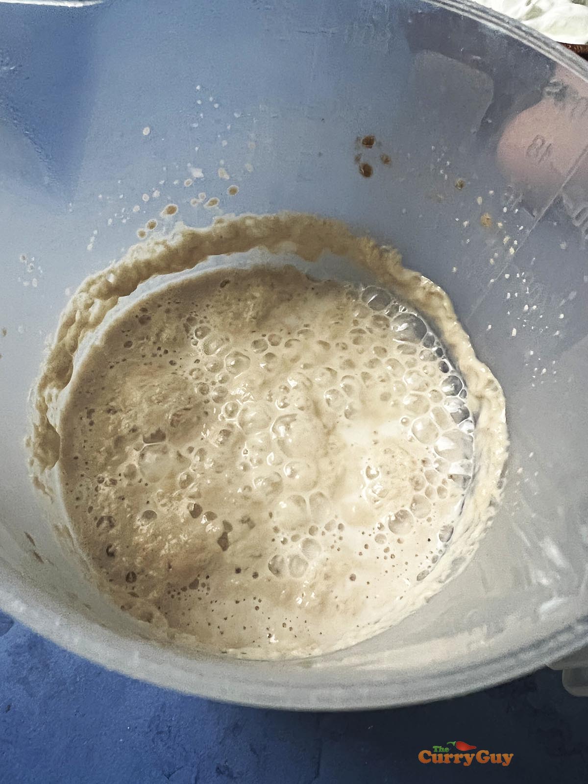 Frothy yeast in milk.