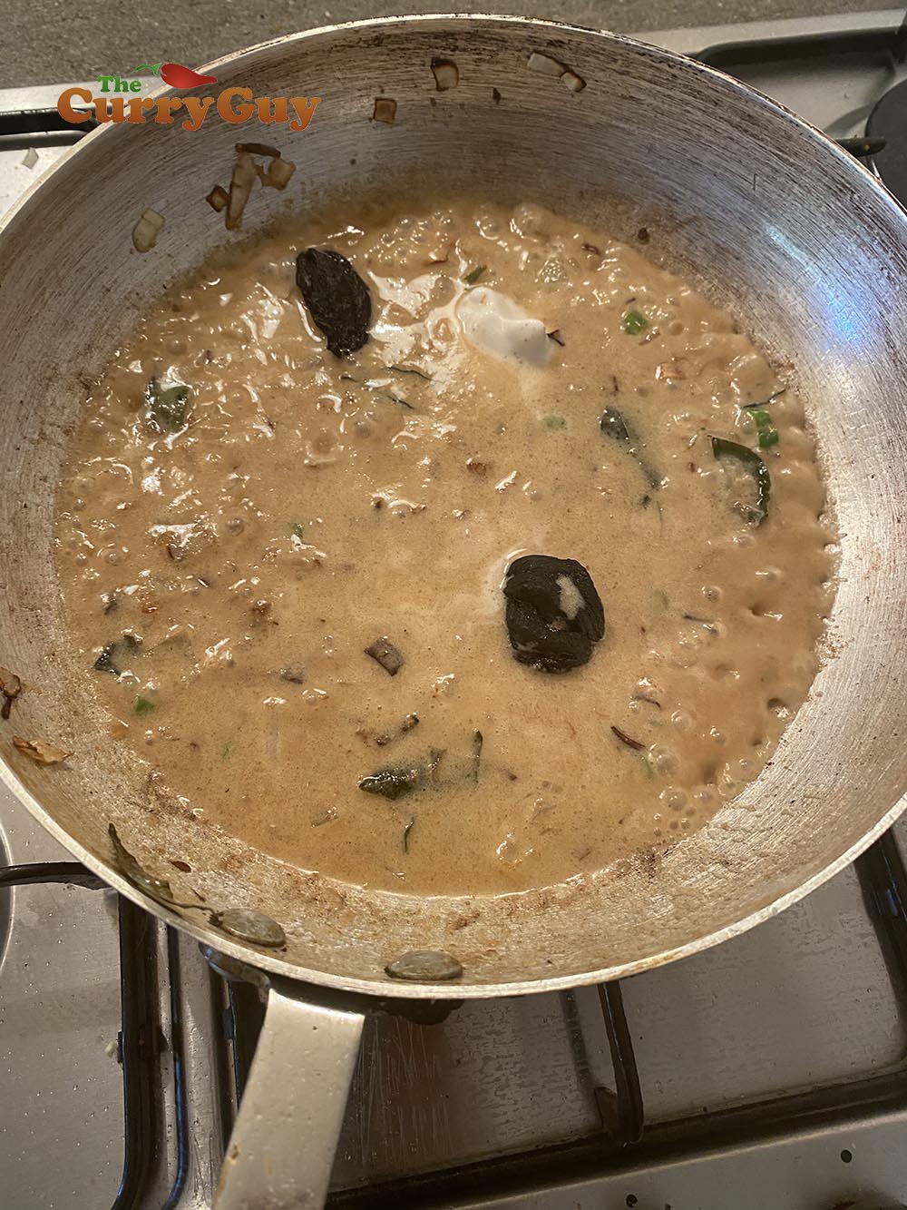 adding coconut milk and kokum