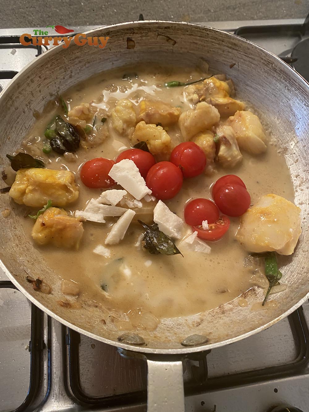 Adding tomatoes and coconut 