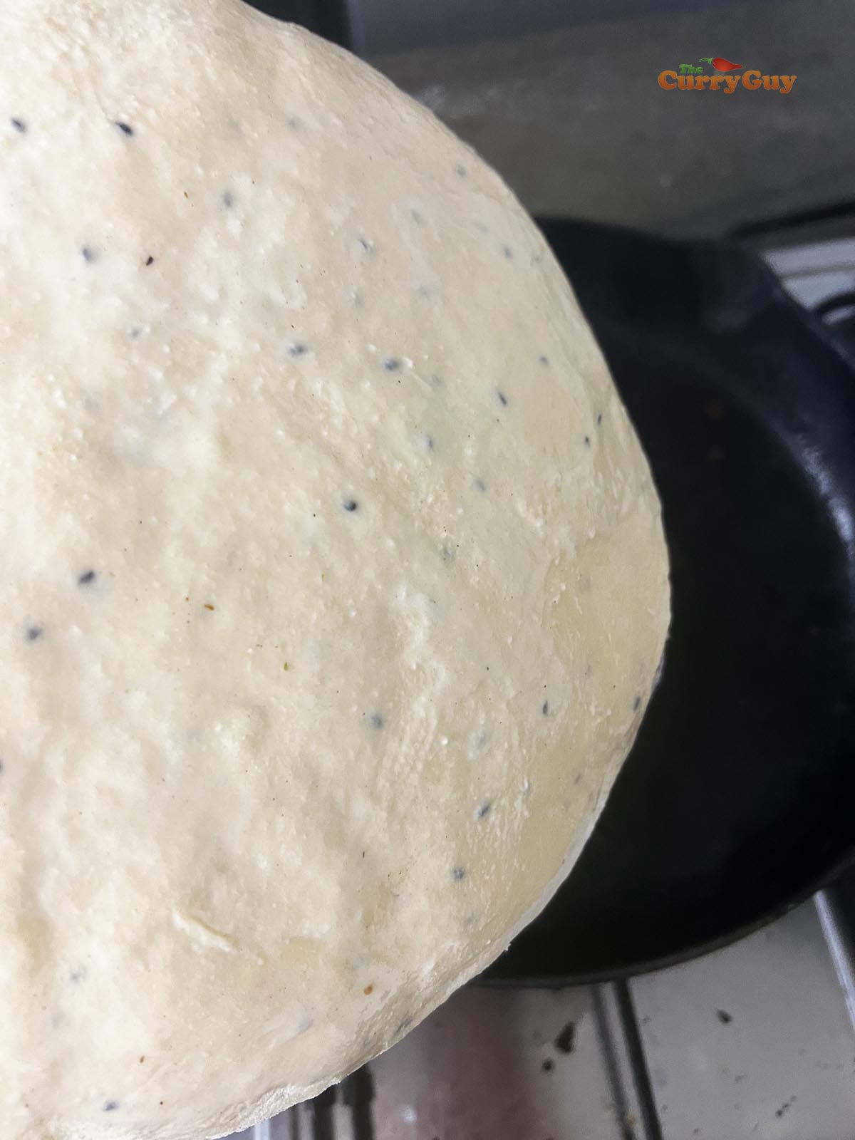 Water coated naan dough.