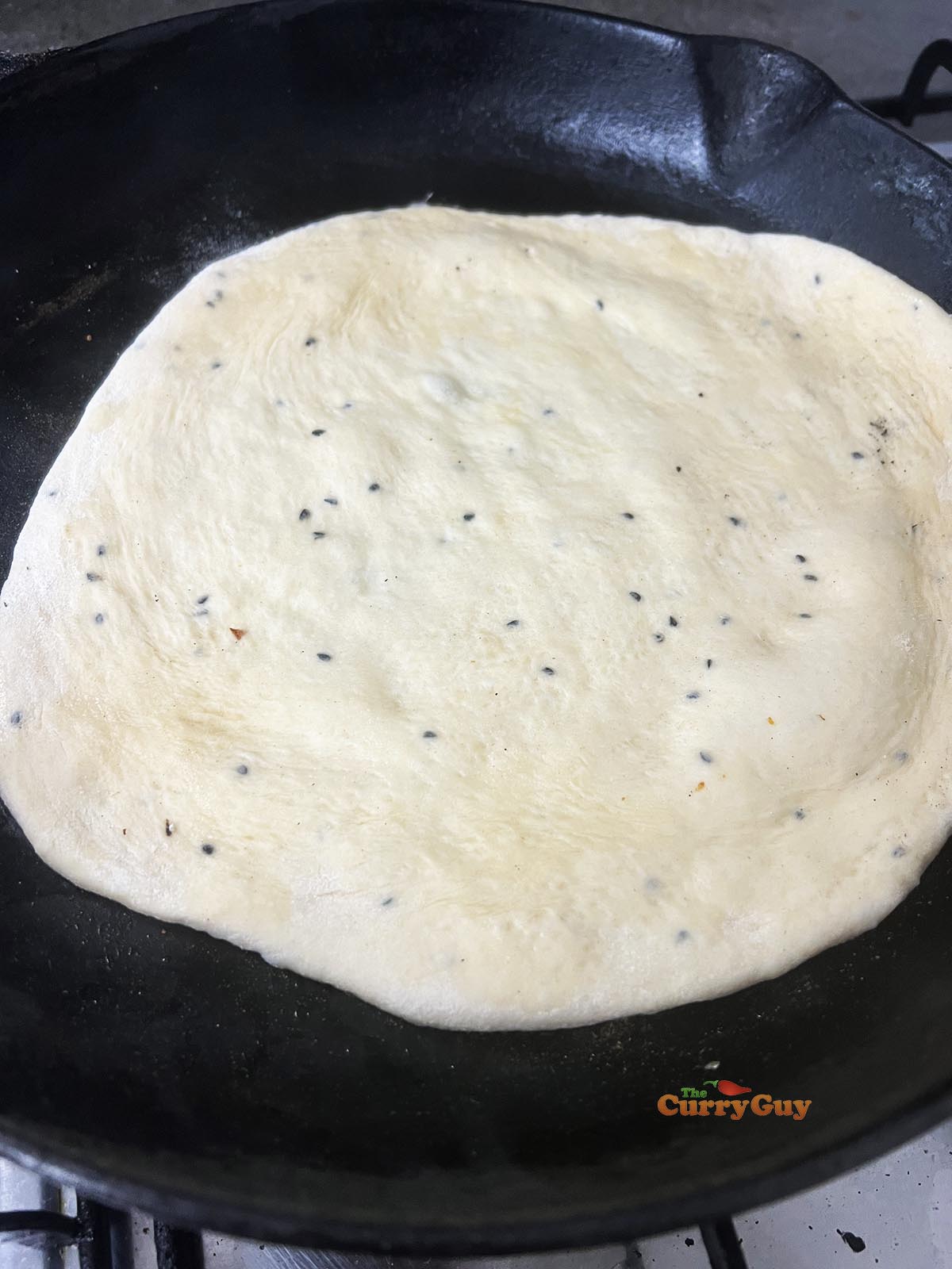 Slapped naan in the pan.