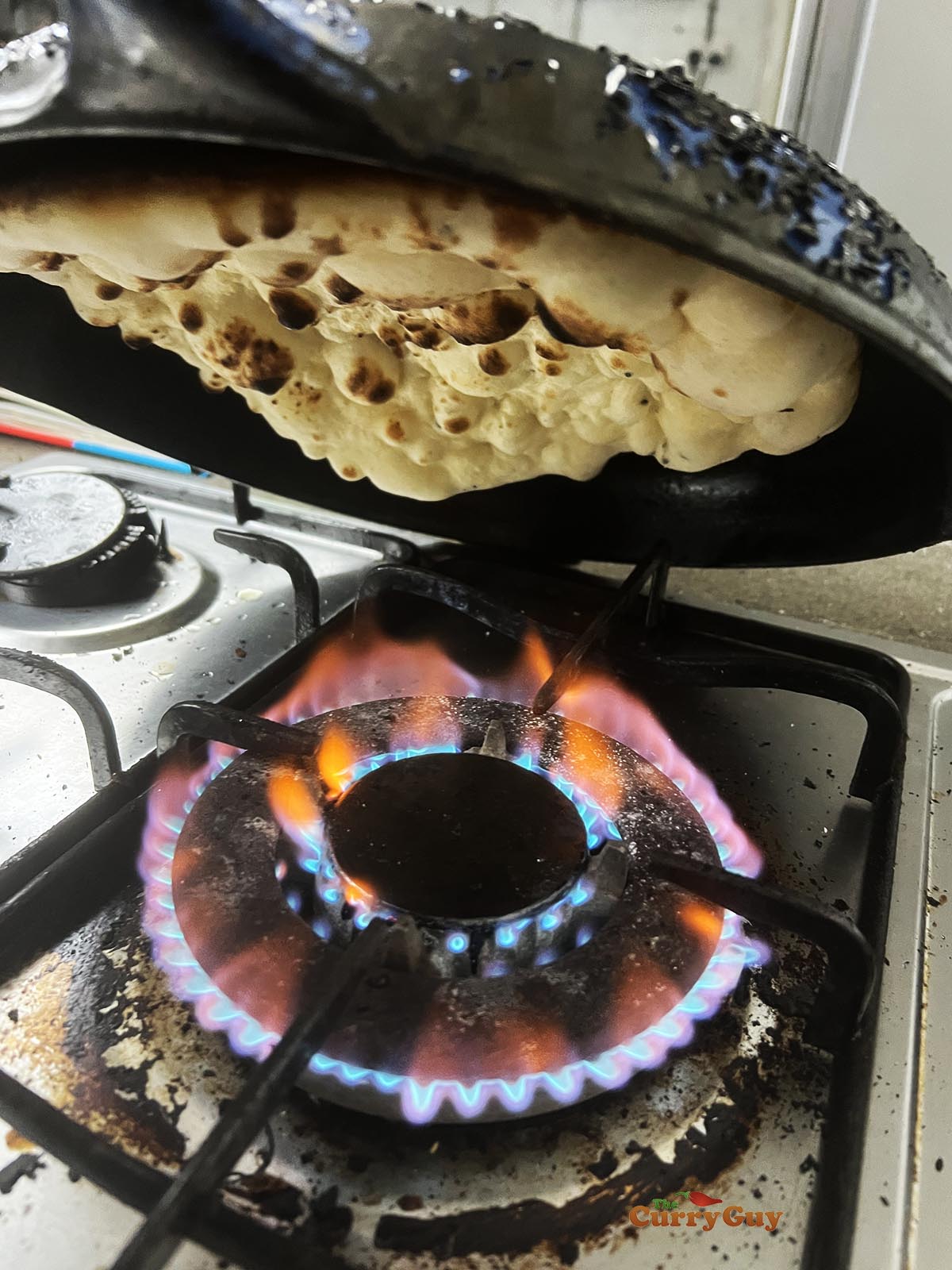 Charring the naan.
