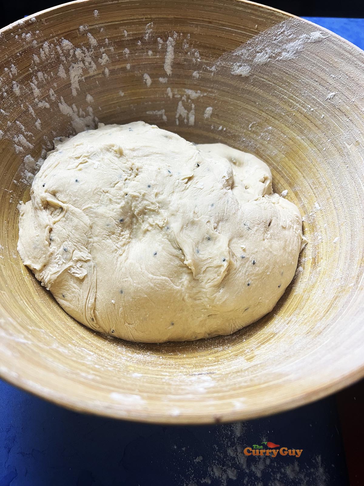 Soft dough ball in a bowl to rise.