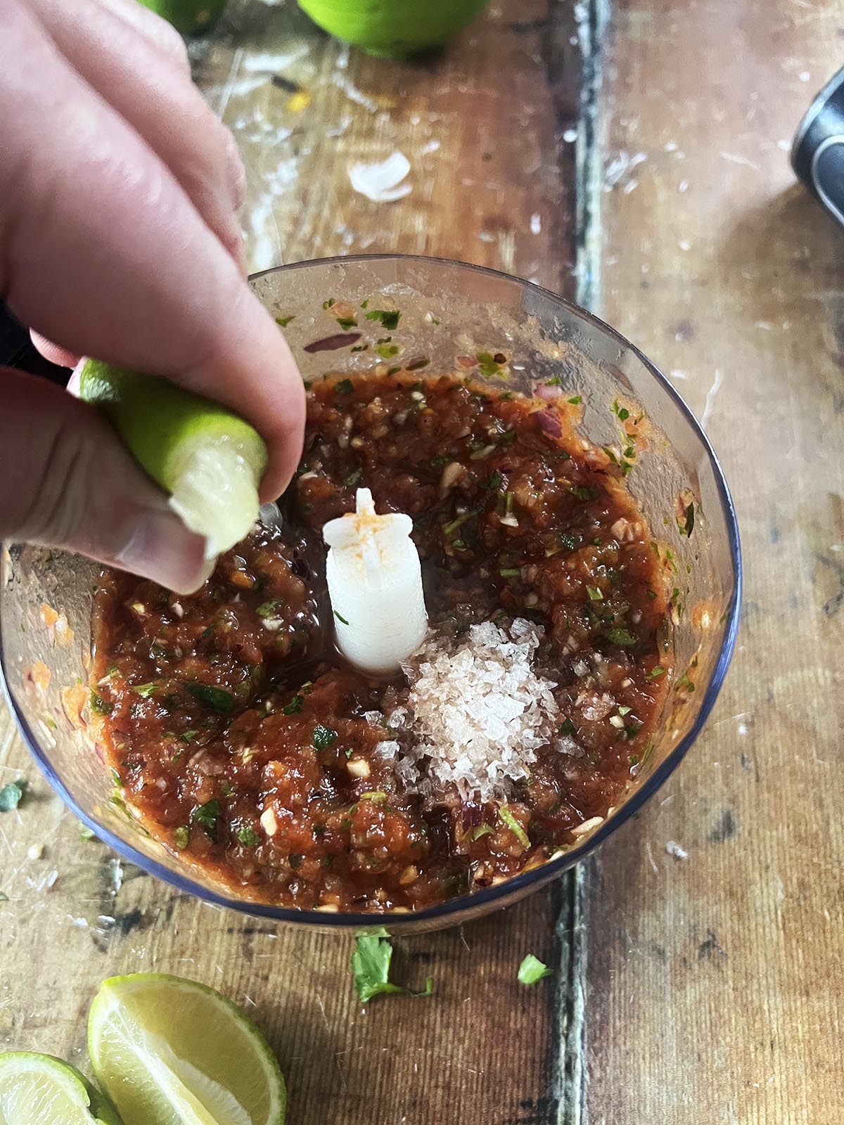Adding salt and lime juice to taste.