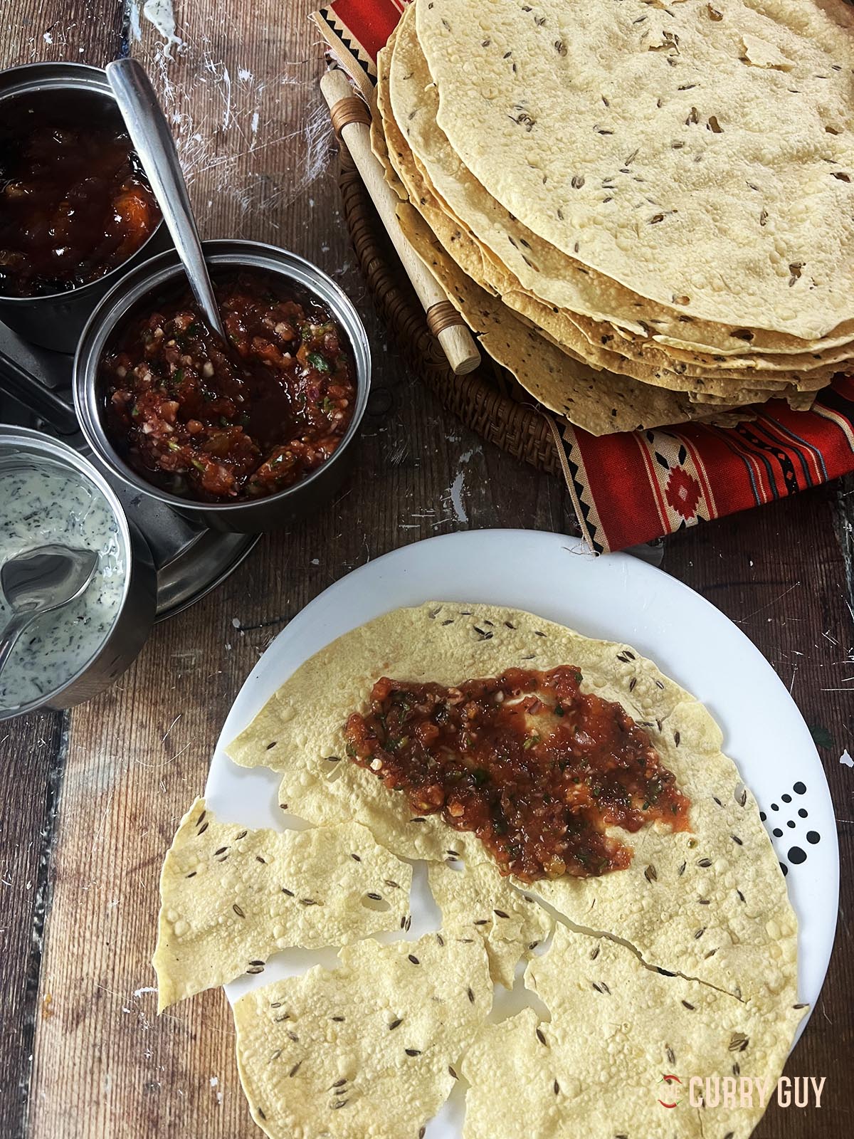 Tomato chilli chutney spread over a poppadom.
