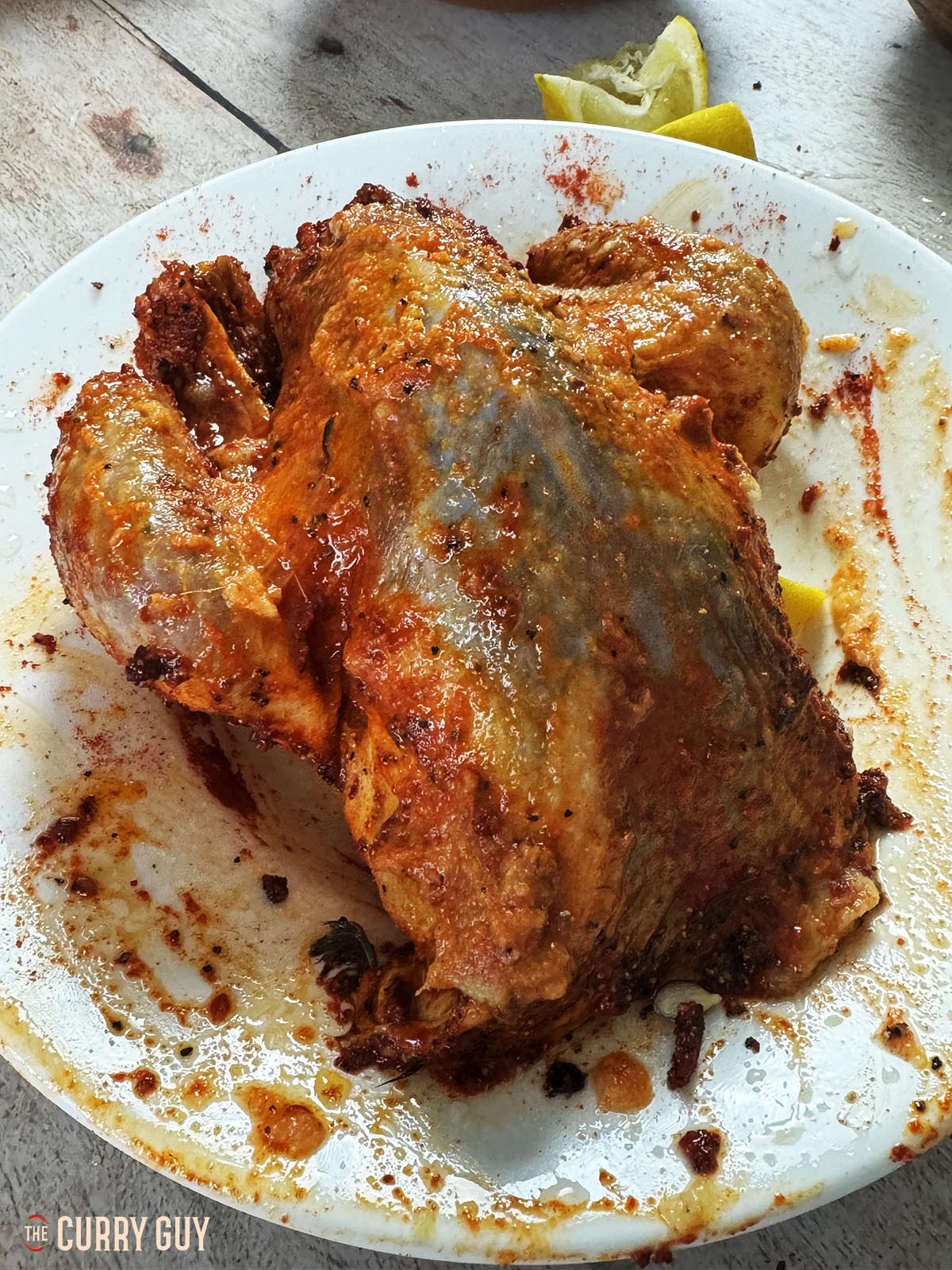 The pheasant rubbed with the garlic and ginger paste, oil, lemon juice and ground spices.