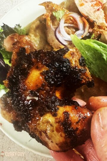 A leg from the roast pheasant right out of the tandoor.