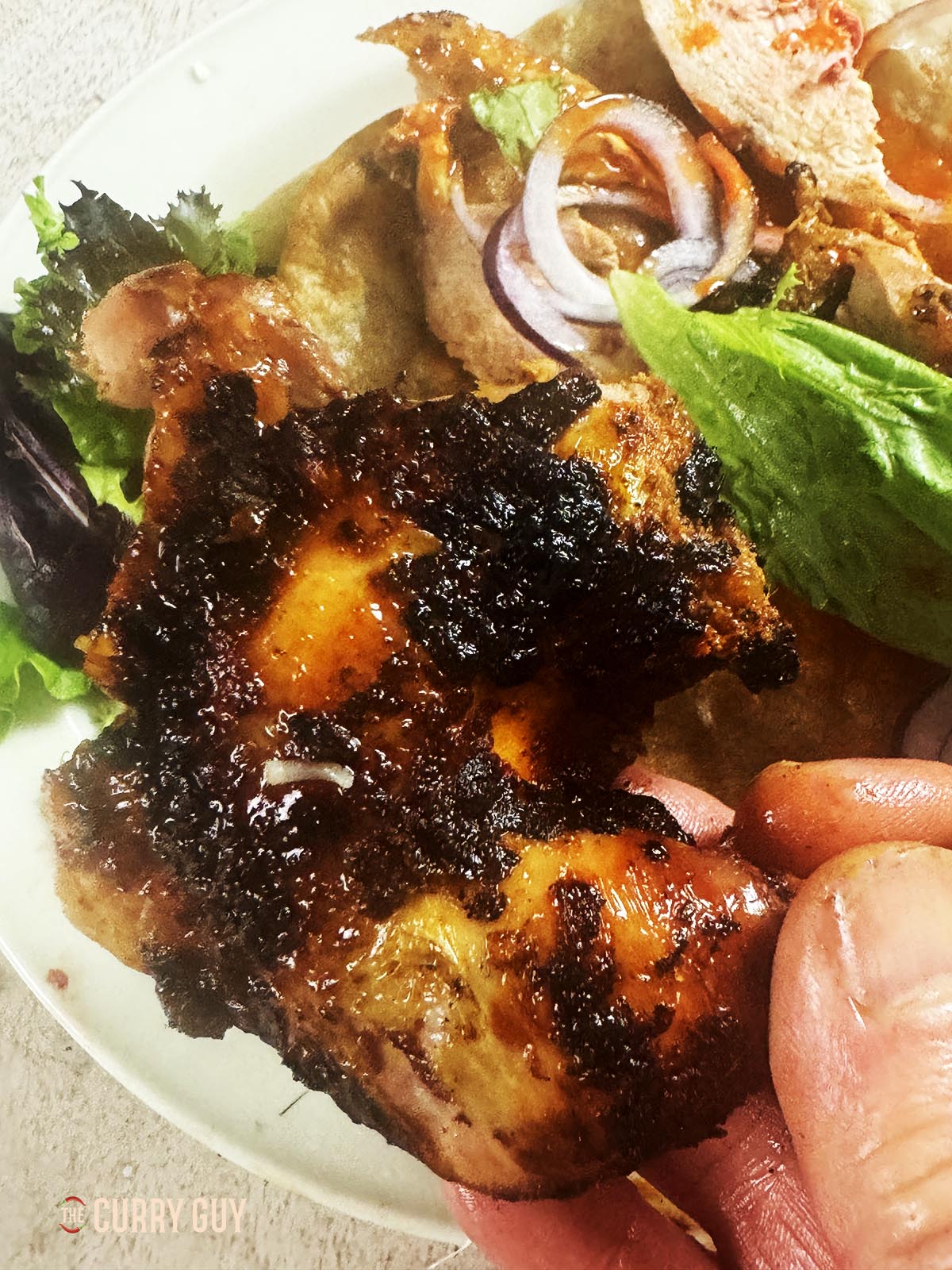 A leg from the roast pheasant right out of the tandoor.