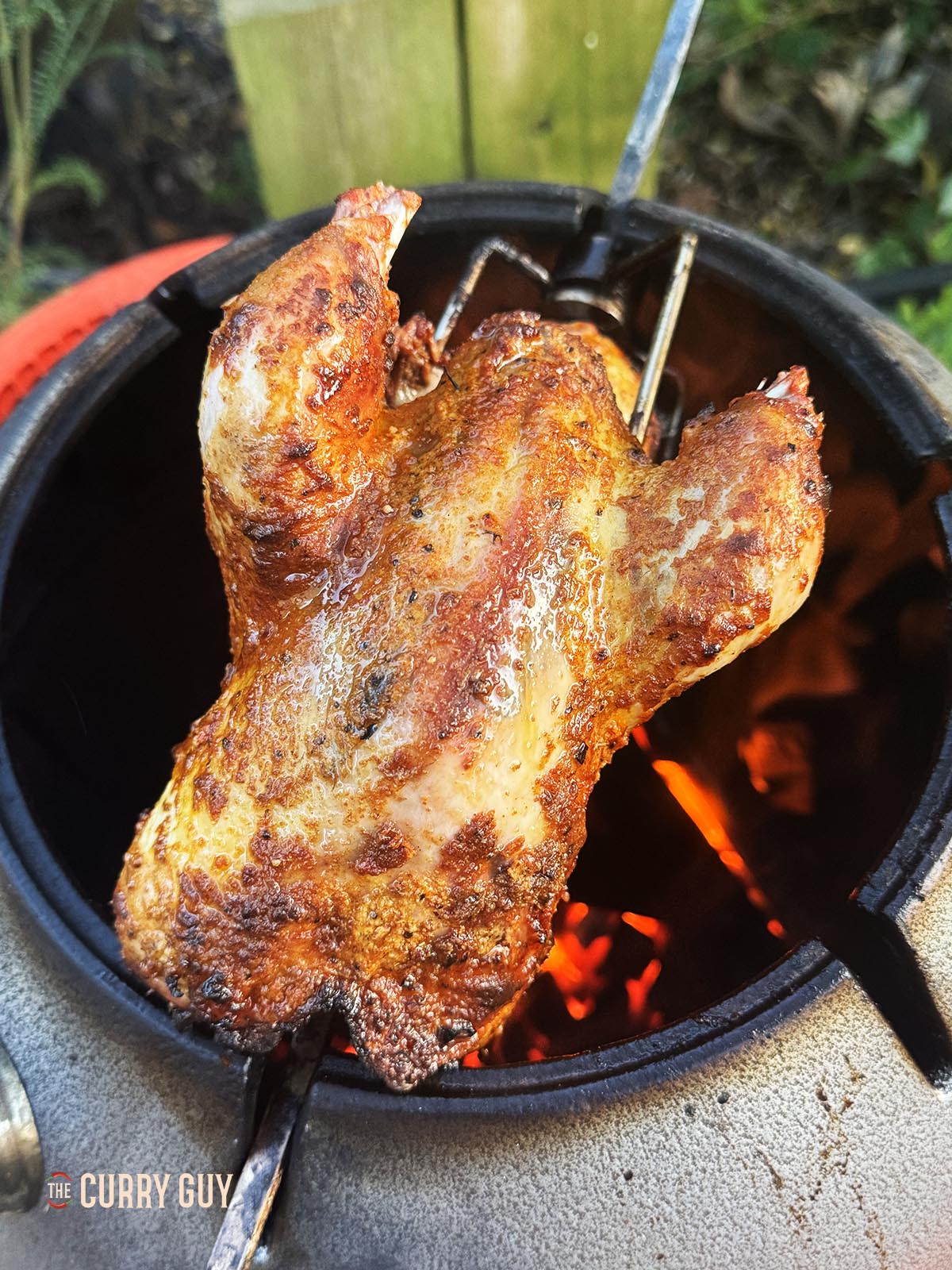 Letting the pheasant cook on top of the tandoor oven. 