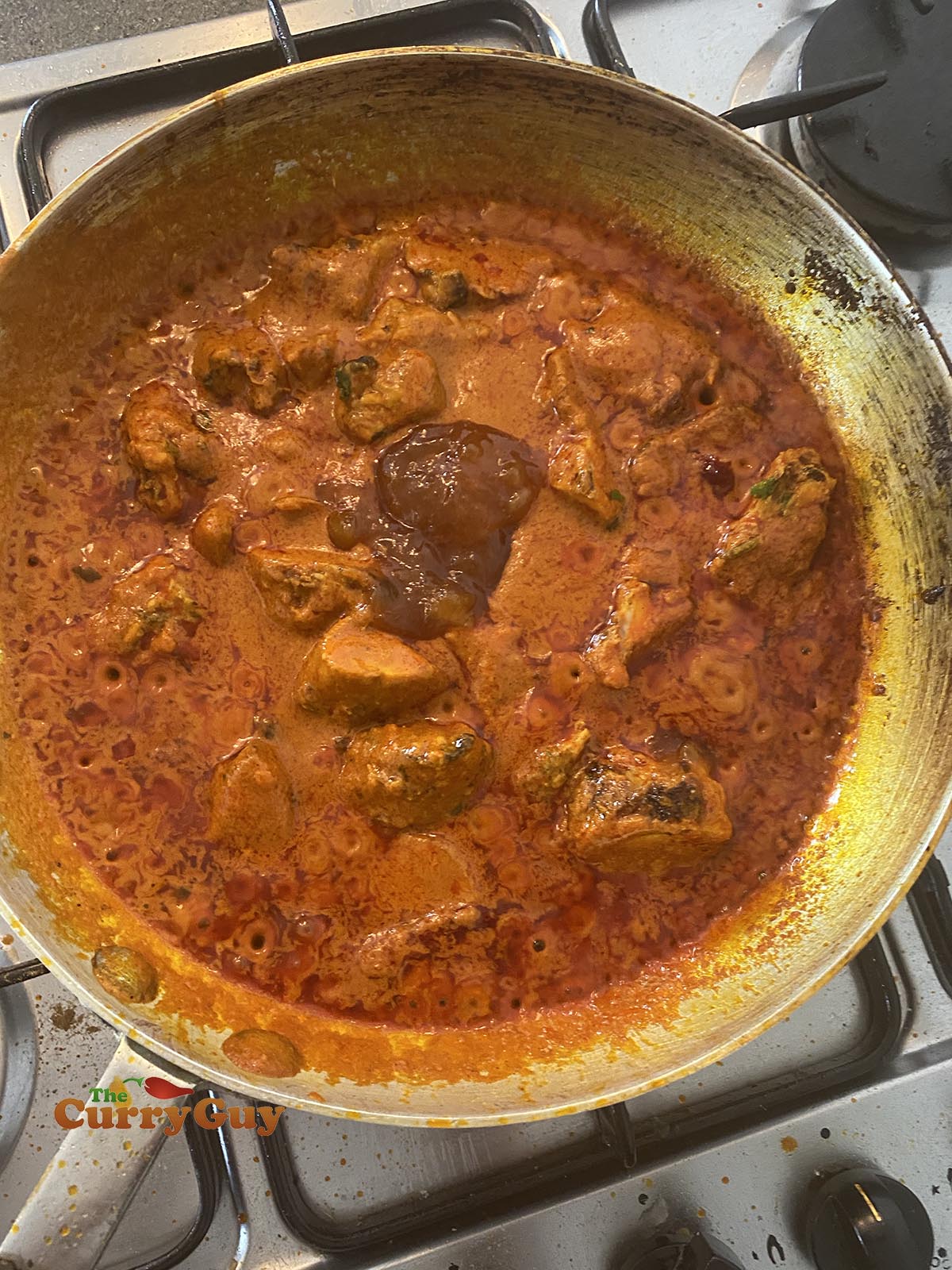 Adding mango chutney to the madras curry