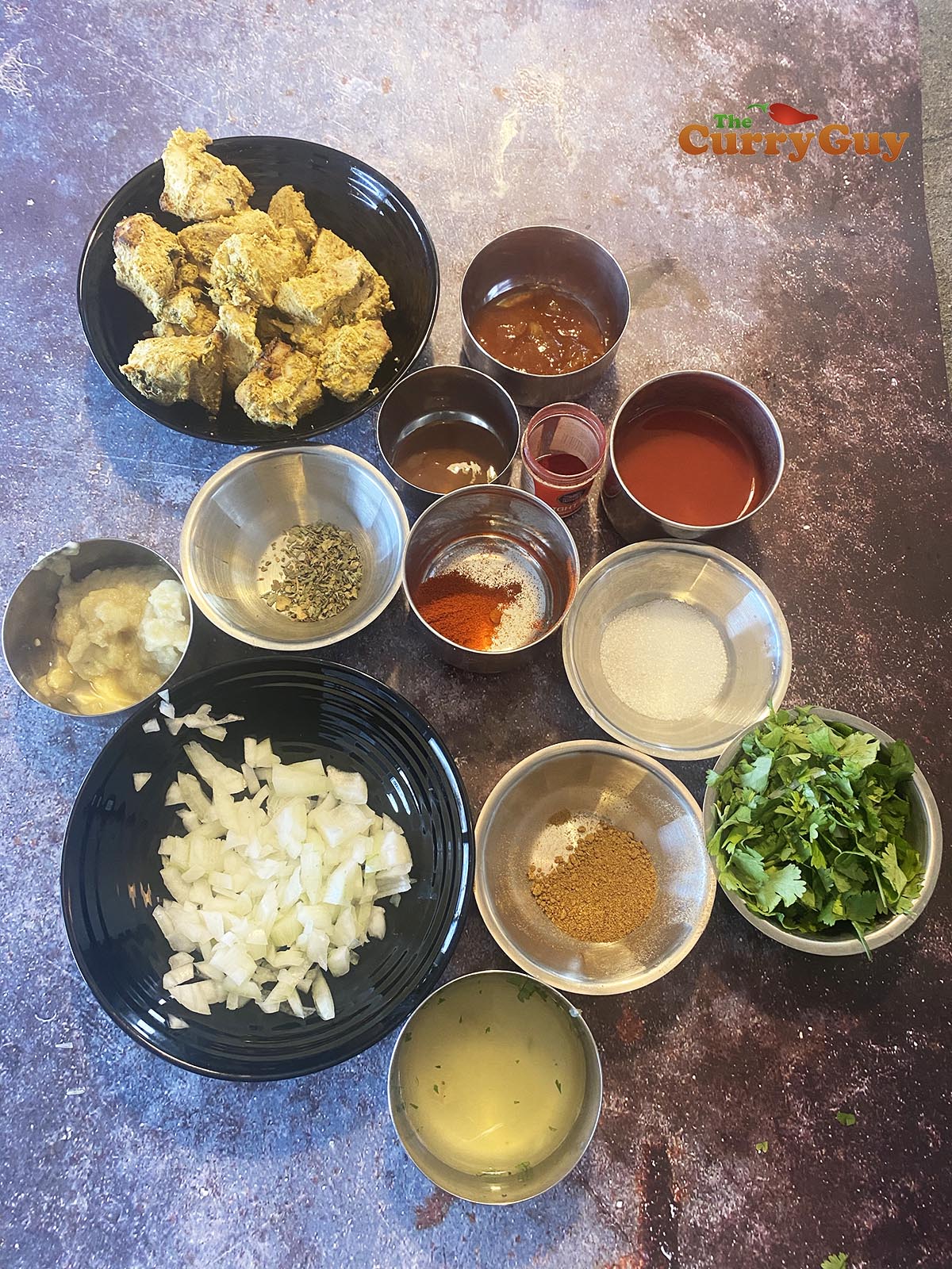 The ingredients for the curry laid out on a counter top ready to use. 