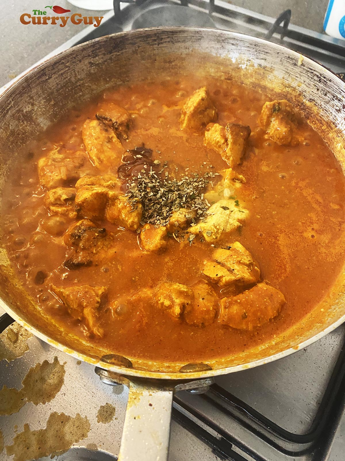 Adding mango chutney and tamarind to give a sweet and sour flavour to the sauce.