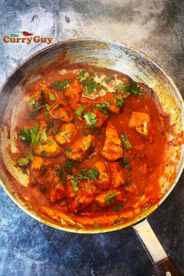 Chicken Pathia curry in a pan.