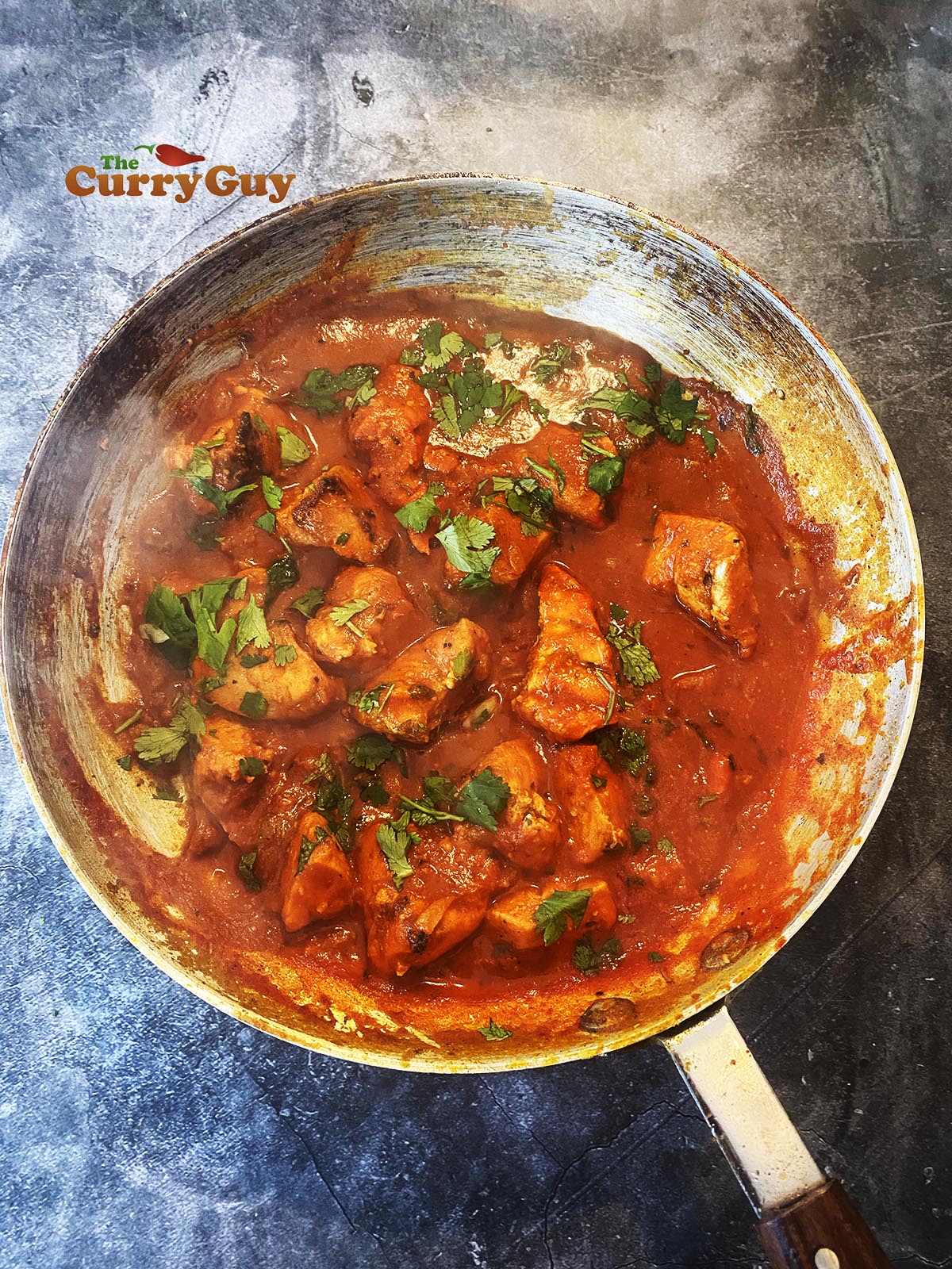 Chicken Pathia curry in a pan.
