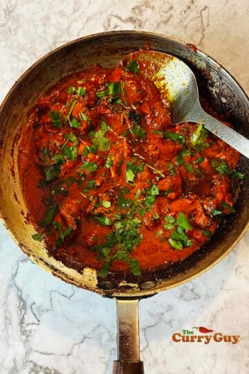 Chicken Tikka Masala Curry in a frying pan ready to serve.