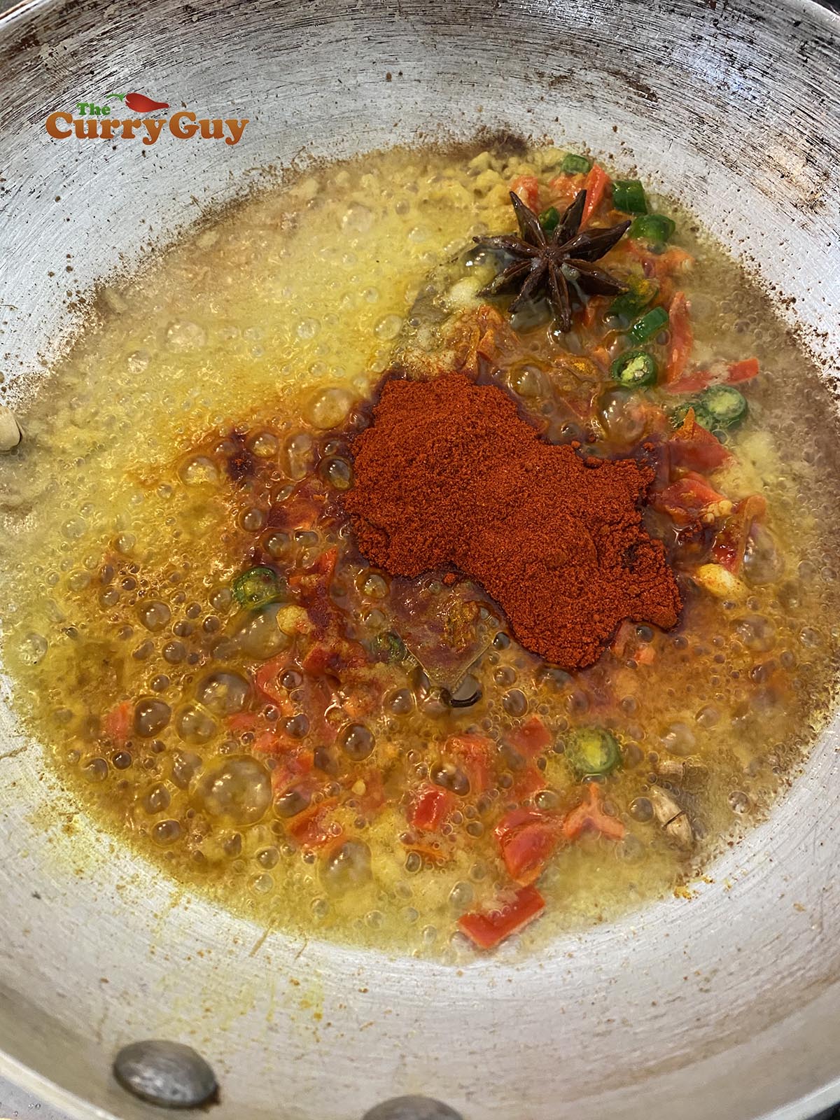 Adding chillies and ground spices