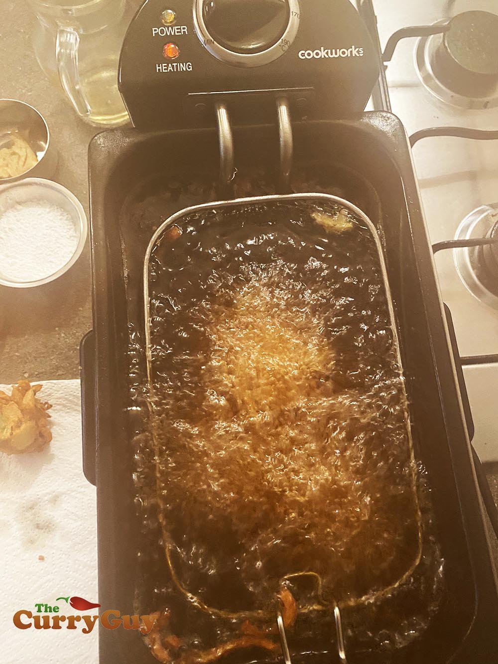 Frying onion bhajis a second time.