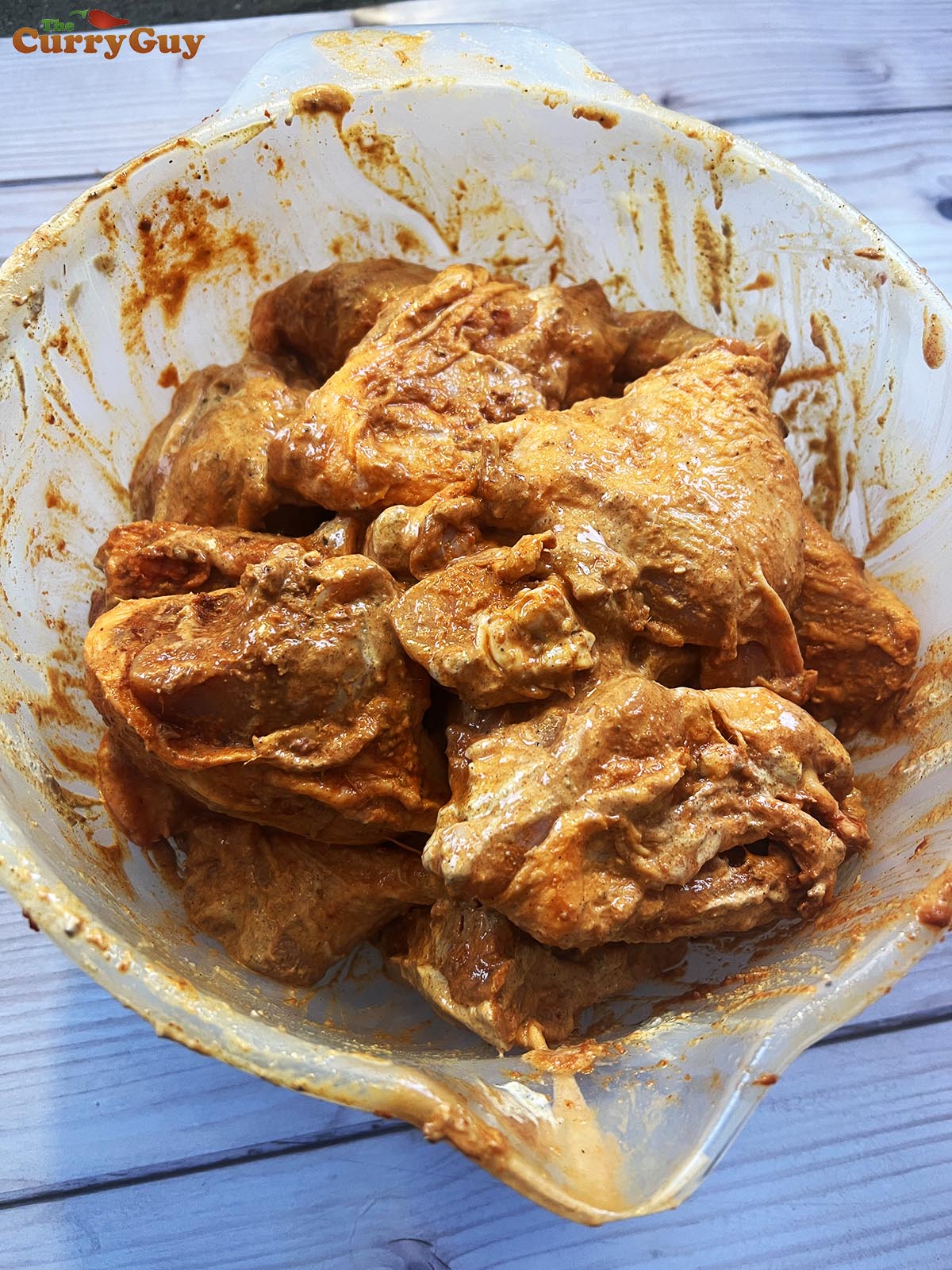 Chicken marinating in second marinade.