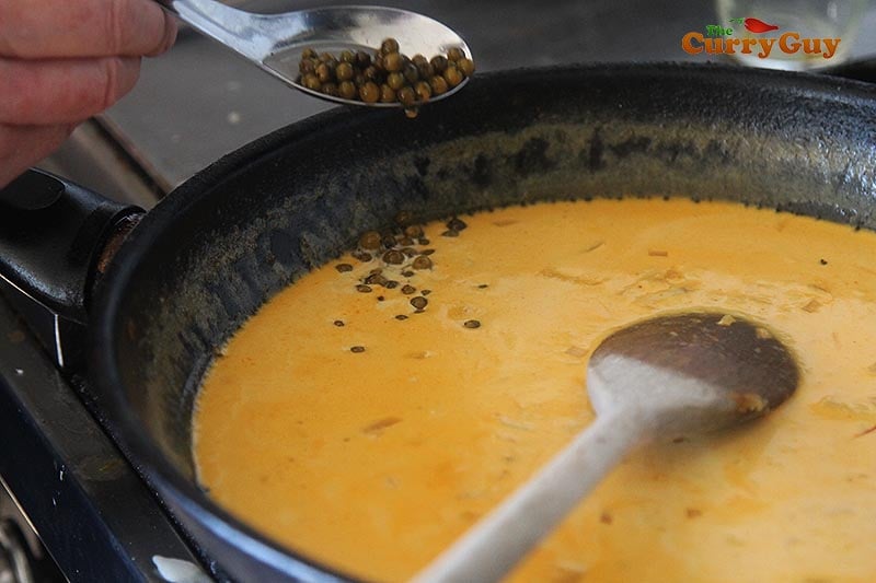 Adding green peppercorns