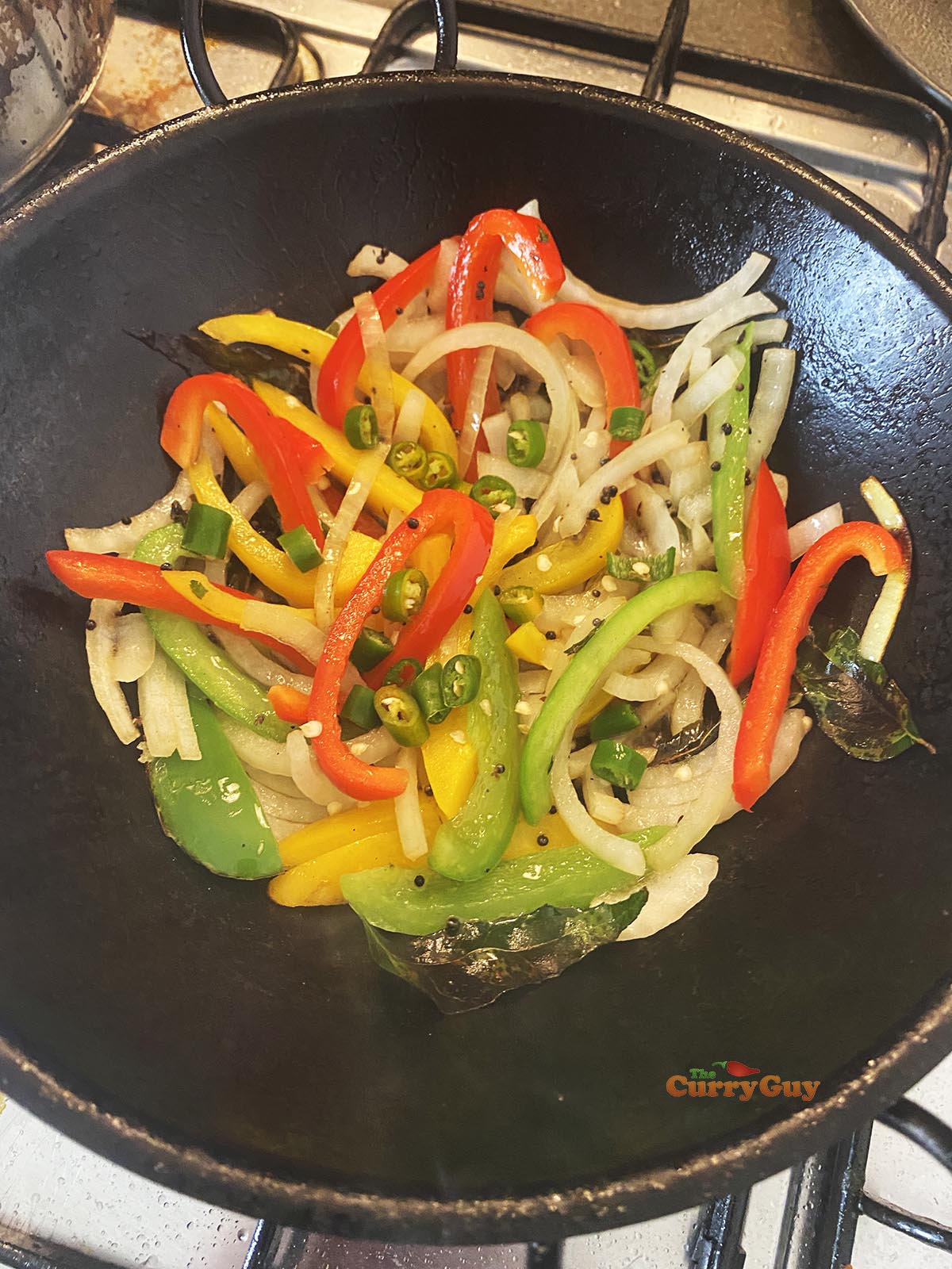 Adding chillies to pan