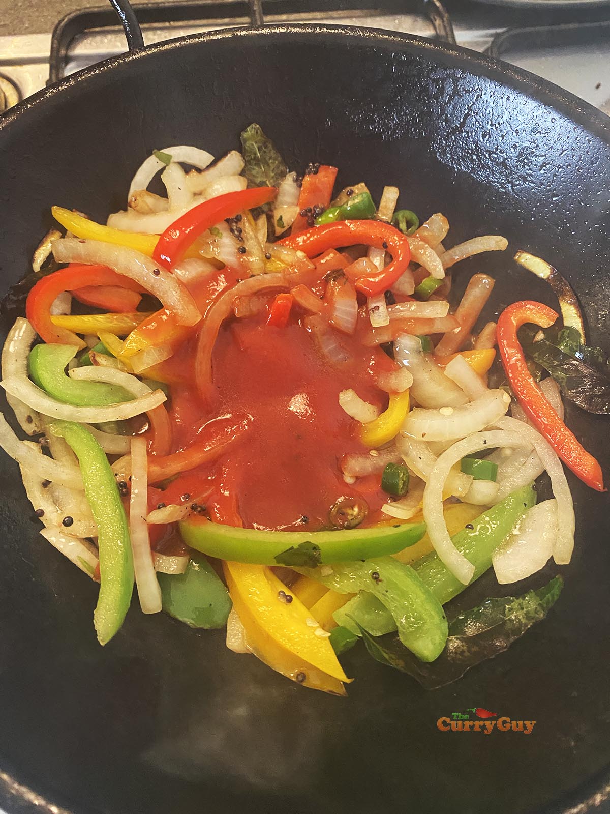 Adding ground spices to pan