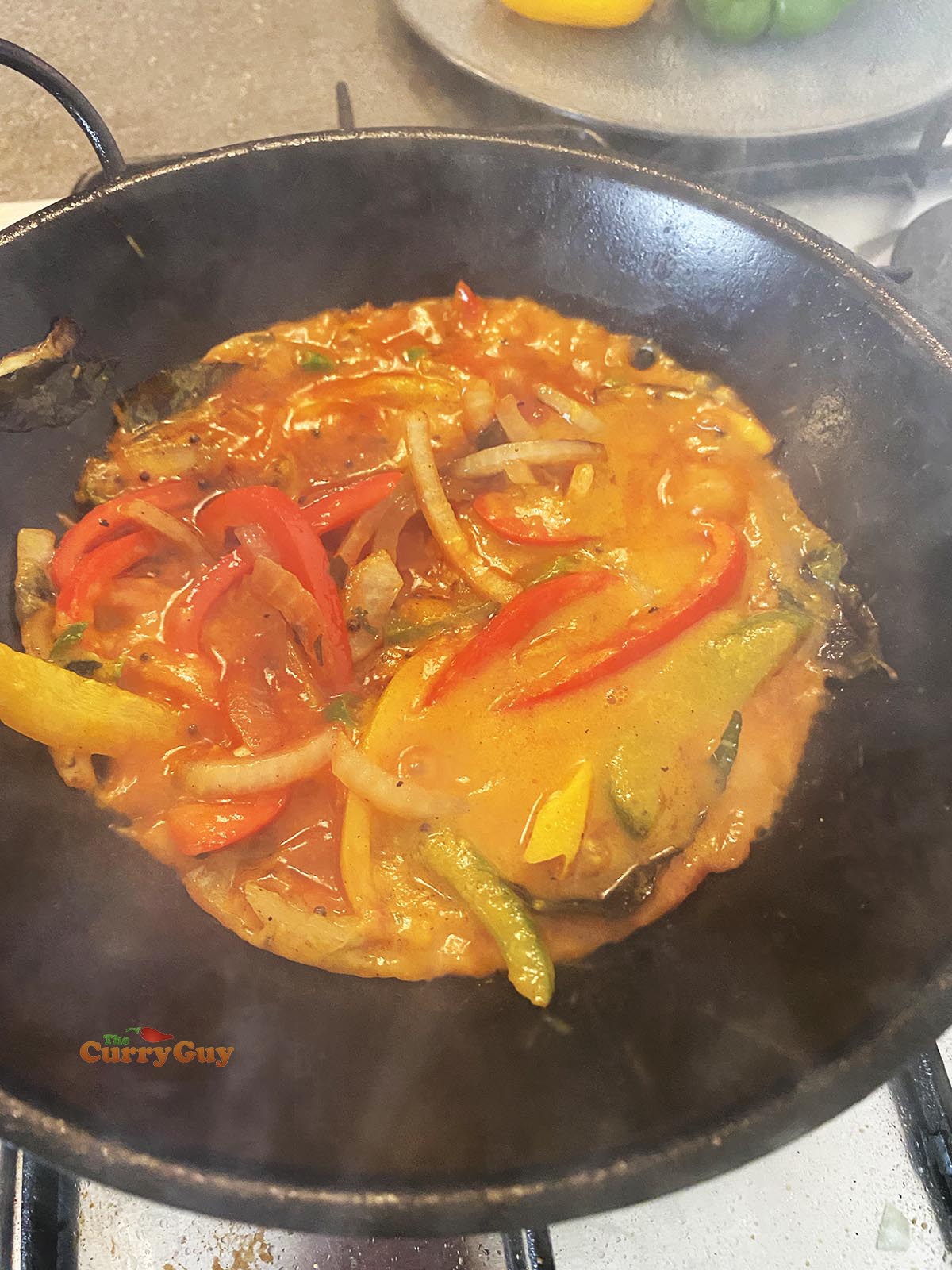 Adding basse sauce to curry