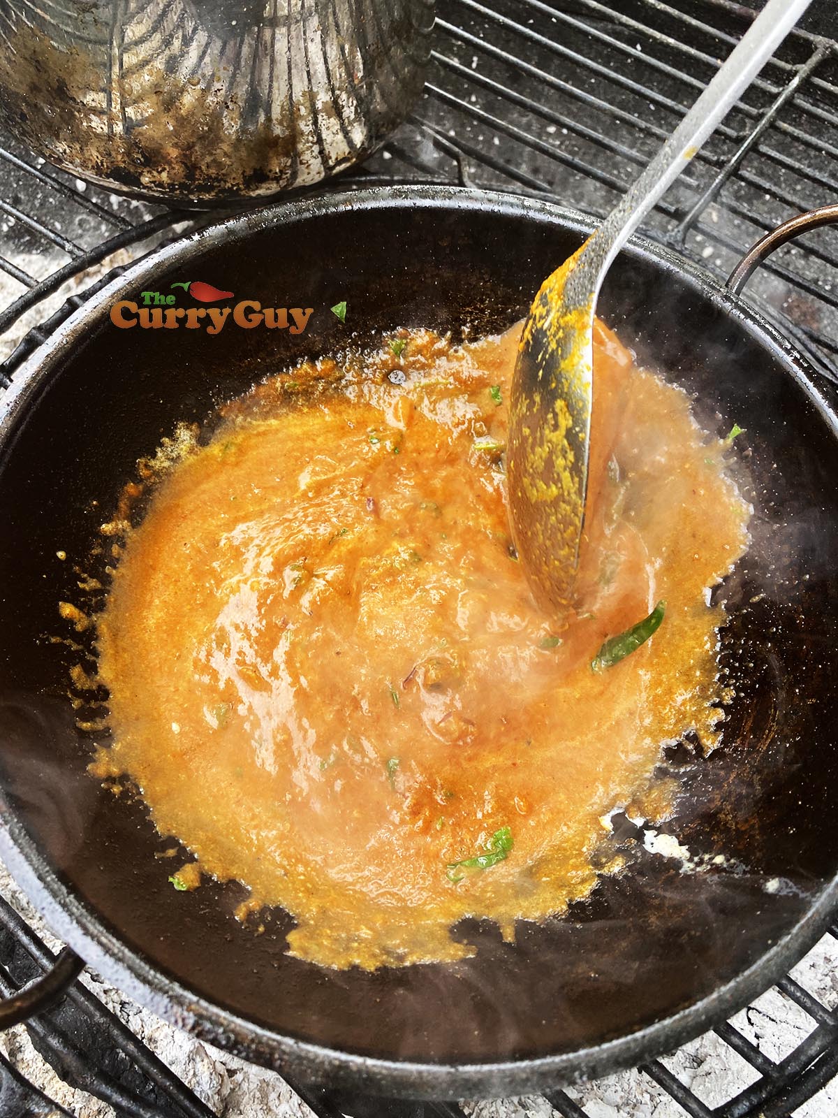 Adding tamarind to balti bowl. 