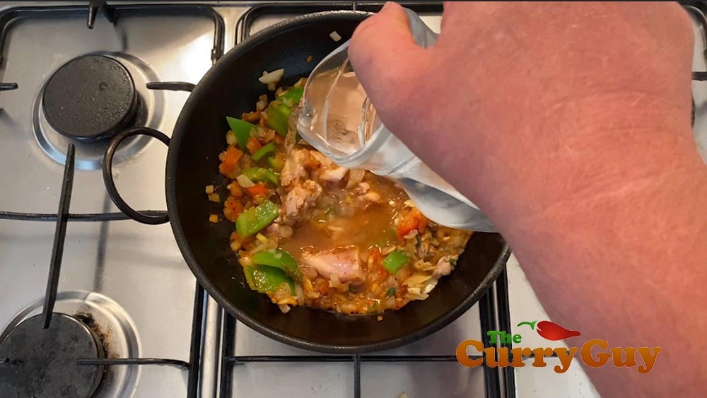 Adding chicken and water