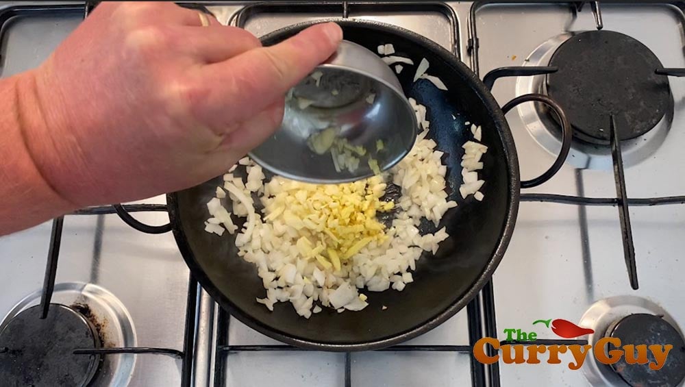 Stirring in the chopped garlic and ginger