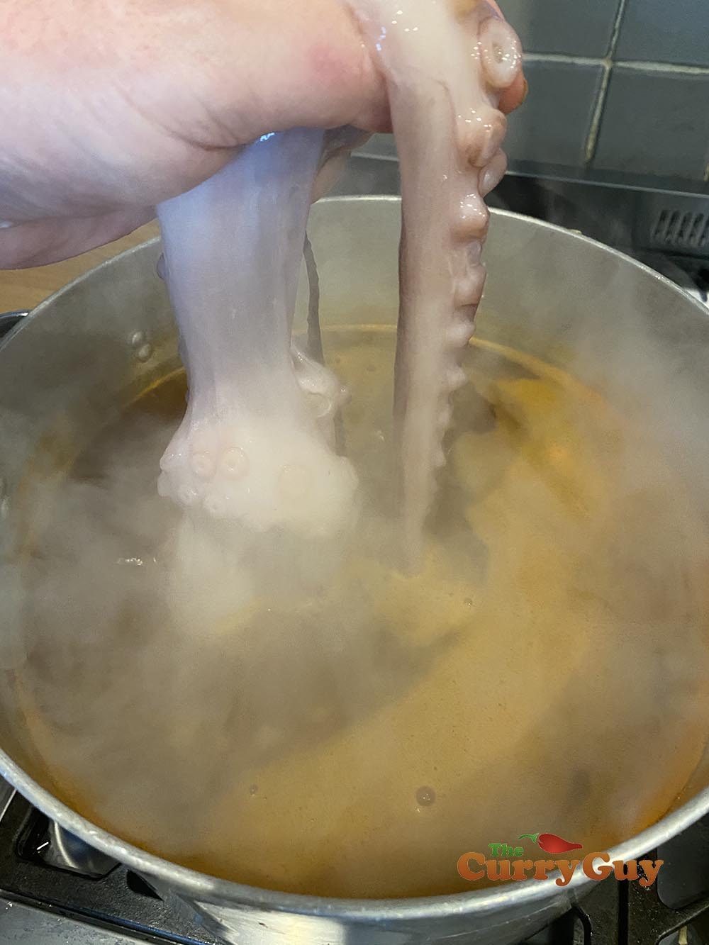 Dropping the octopus into the water.