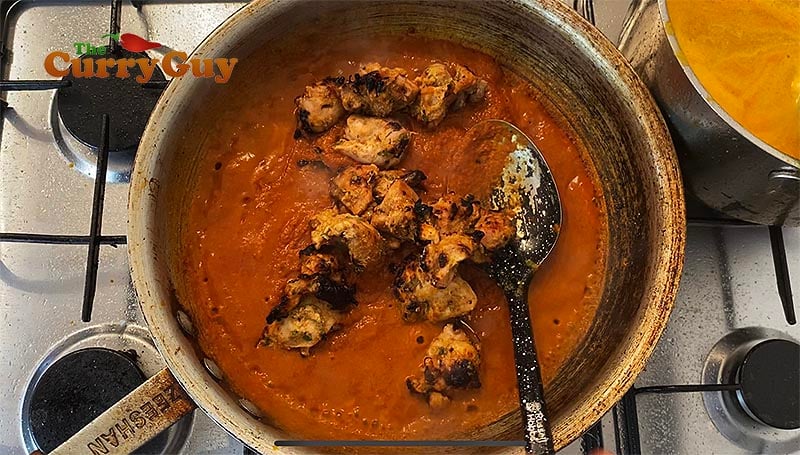 Adding chicken to the sauce