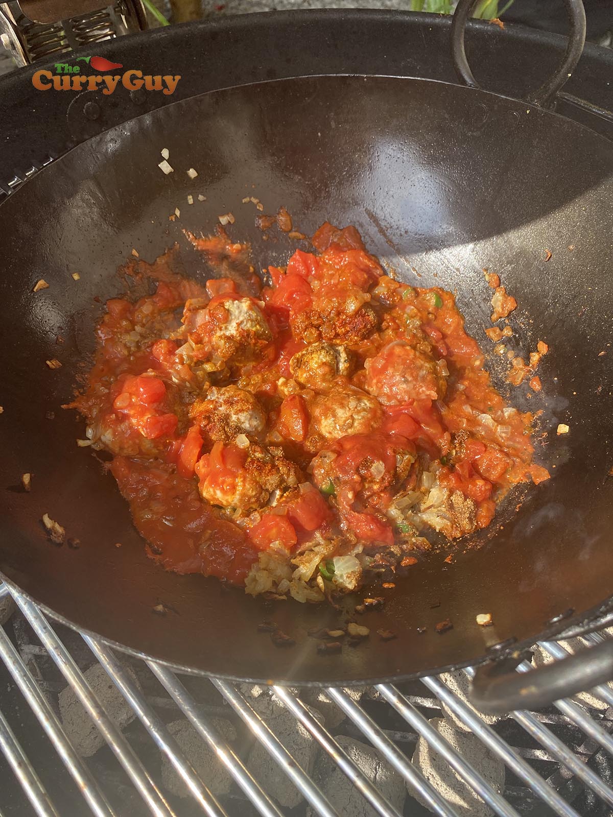 Adding chopped tomatoes