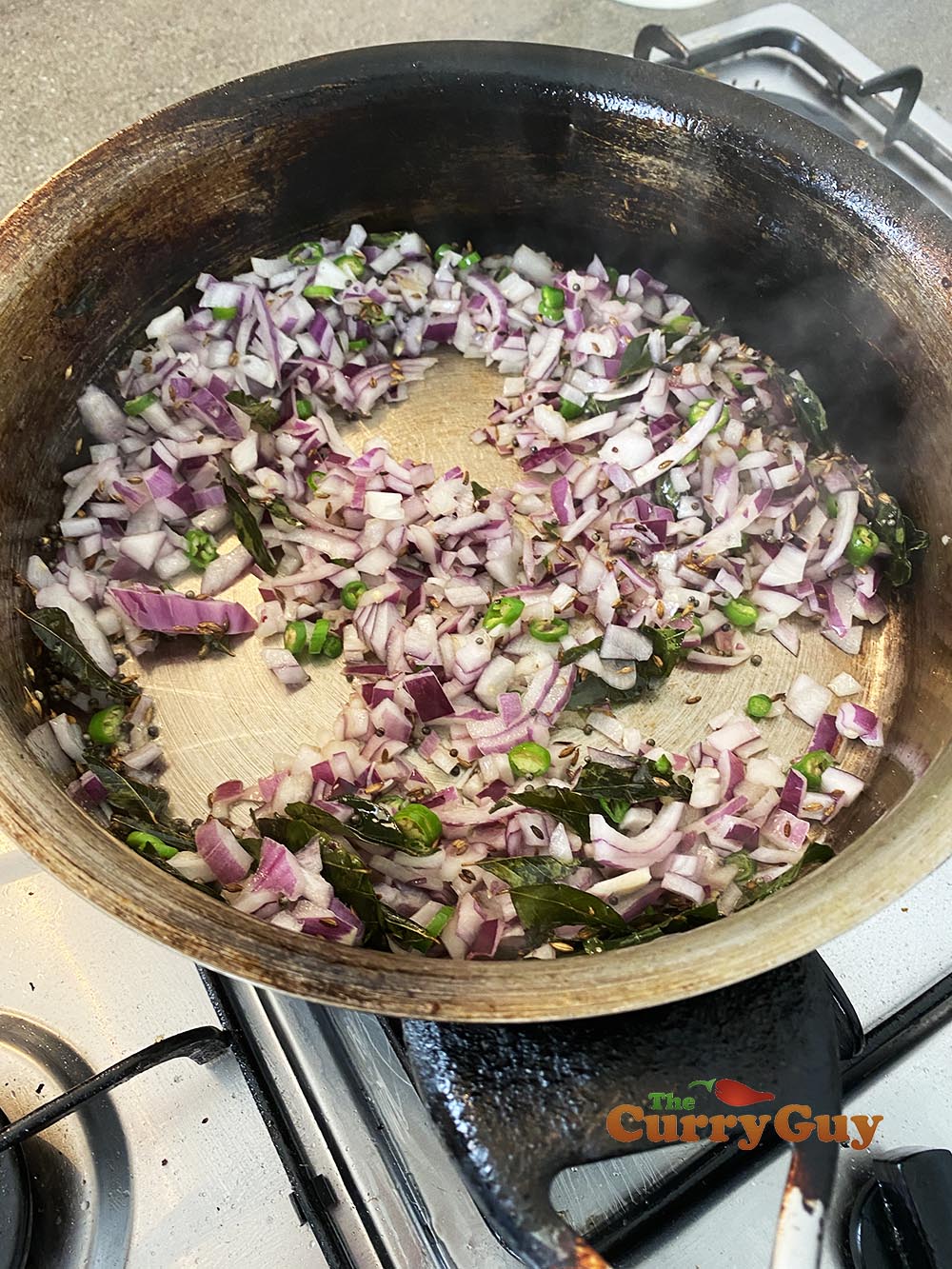 adding onions and curry leaves