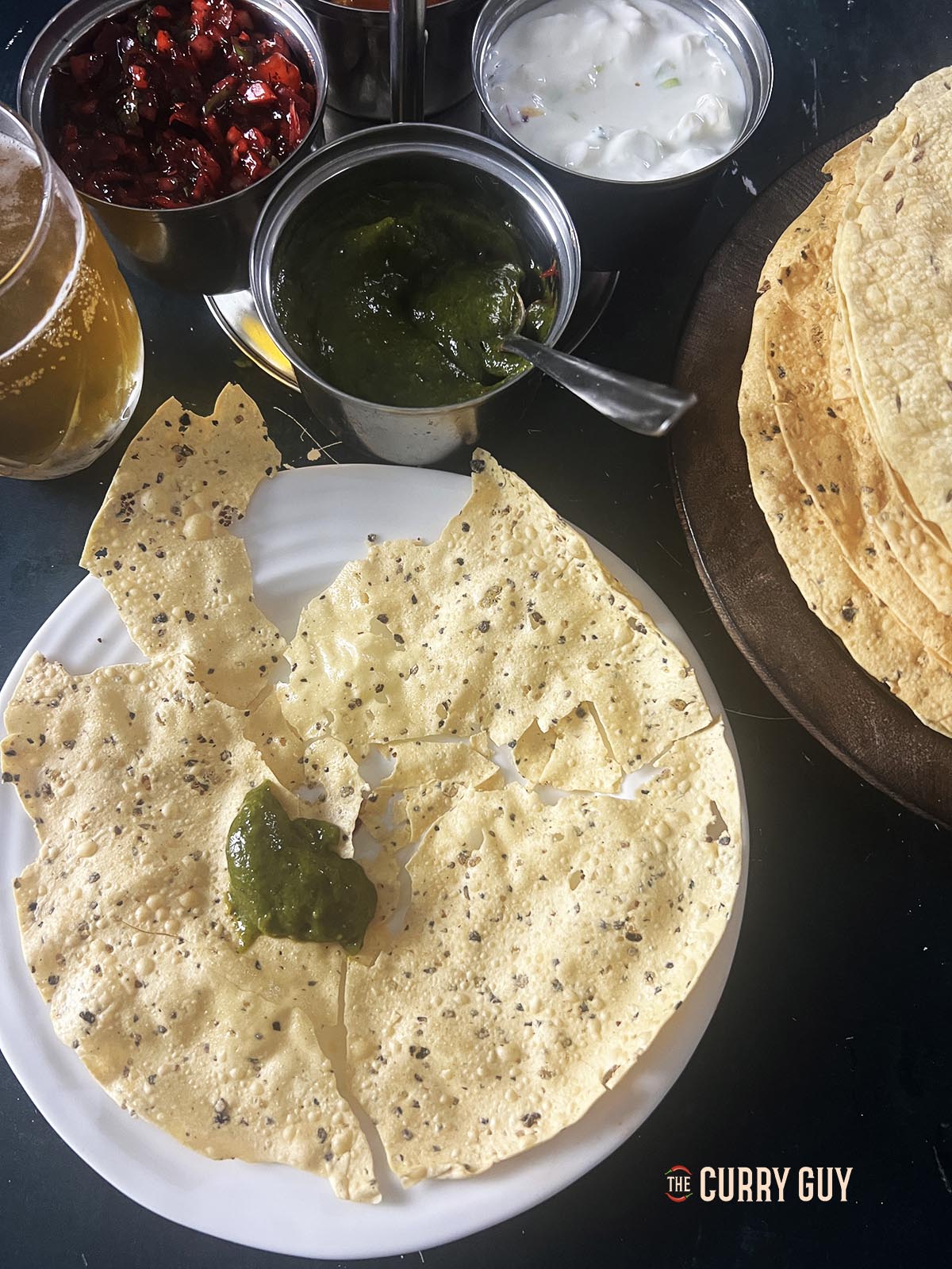 Mint and coriander chutney on a poppadom.