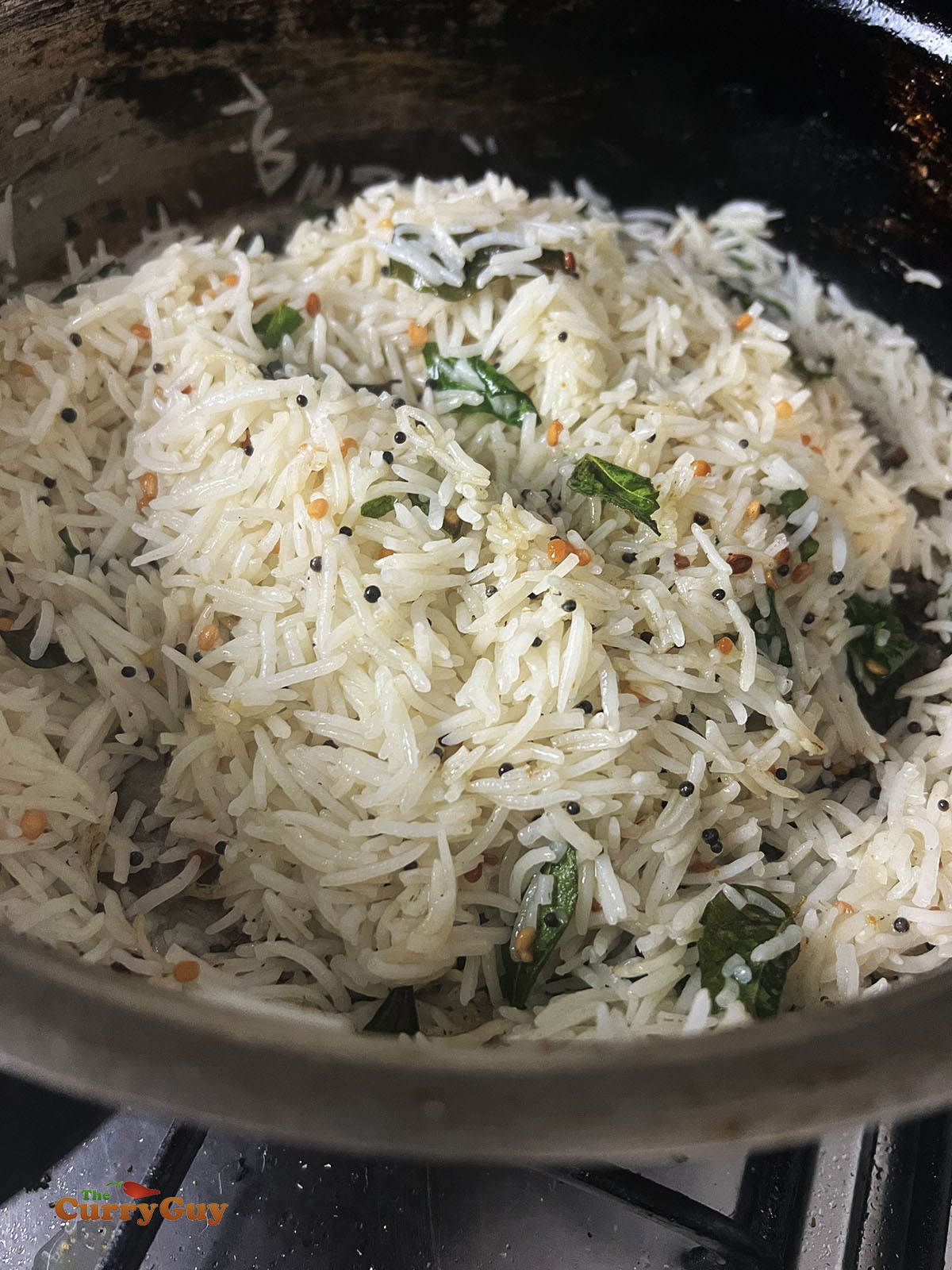 Finishing off the lemon fried rice in the pan.