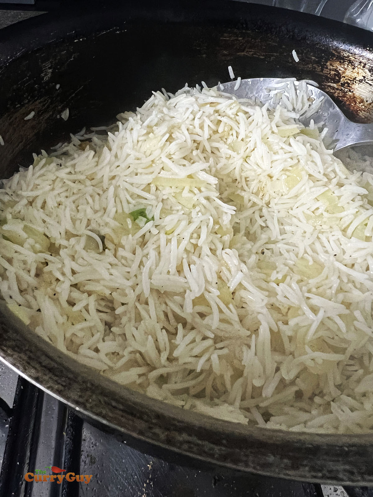Cooking onion fried rice.