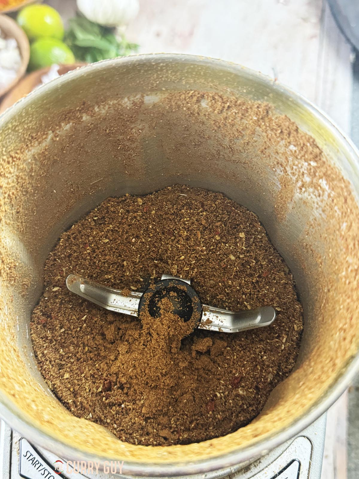 The whole spices grounded to a powder in a spice grinder.